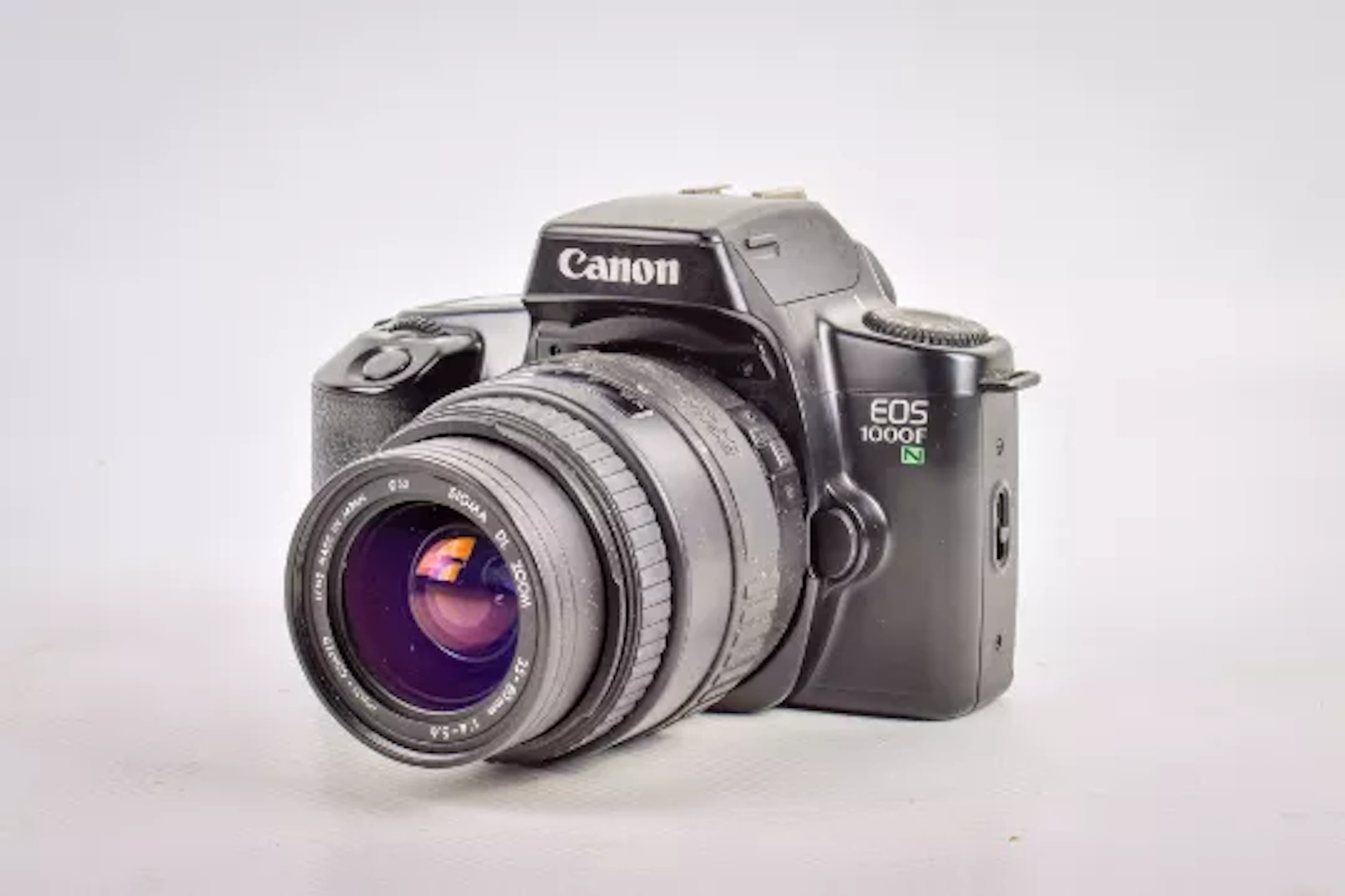 A Canon EOS 1000F N 35mm SLR camera. With a Sigma DL Zoom 35-80mm