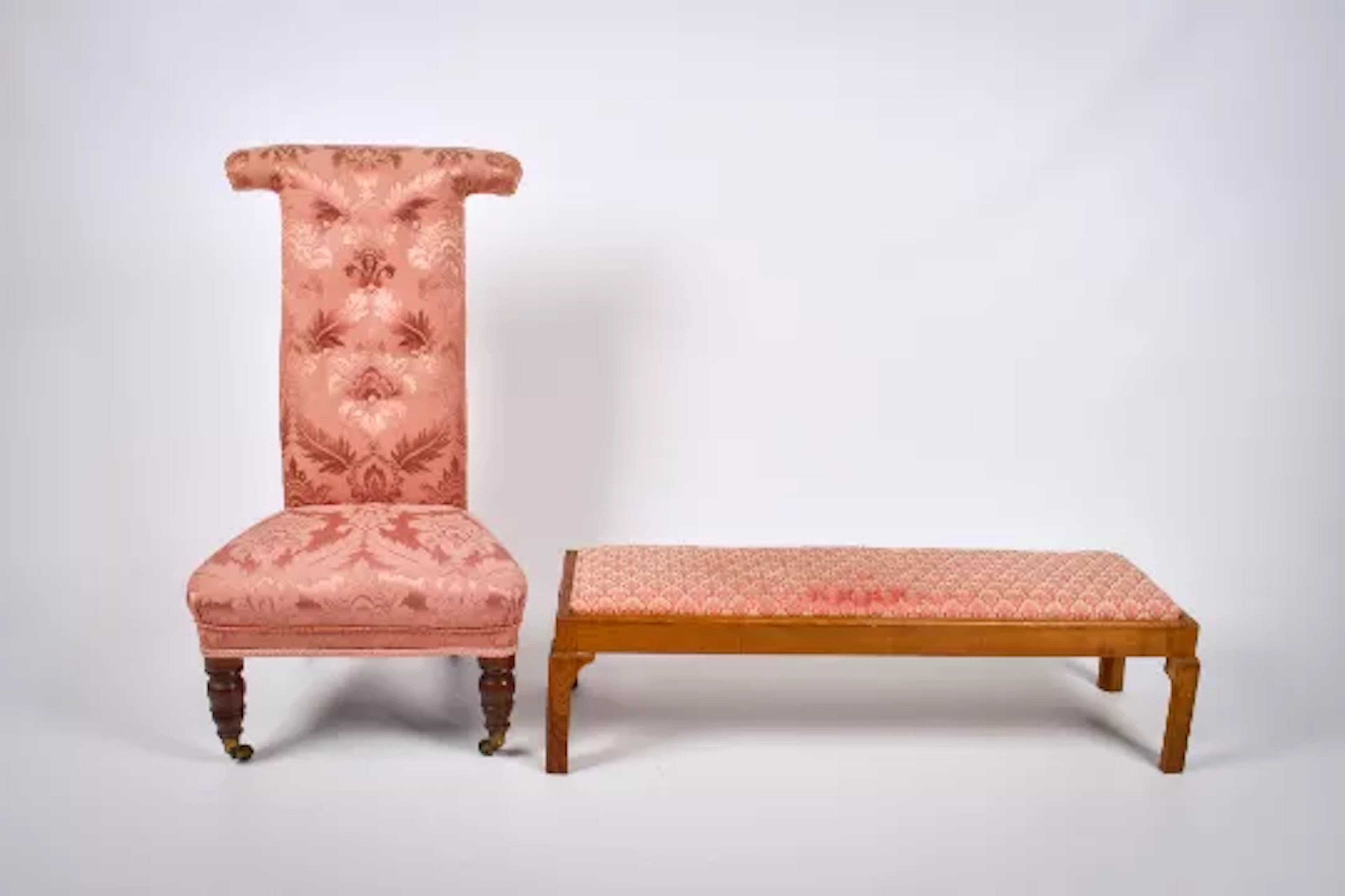 A Victorian prayer chair and low bench stool, both with pink upholstery.
