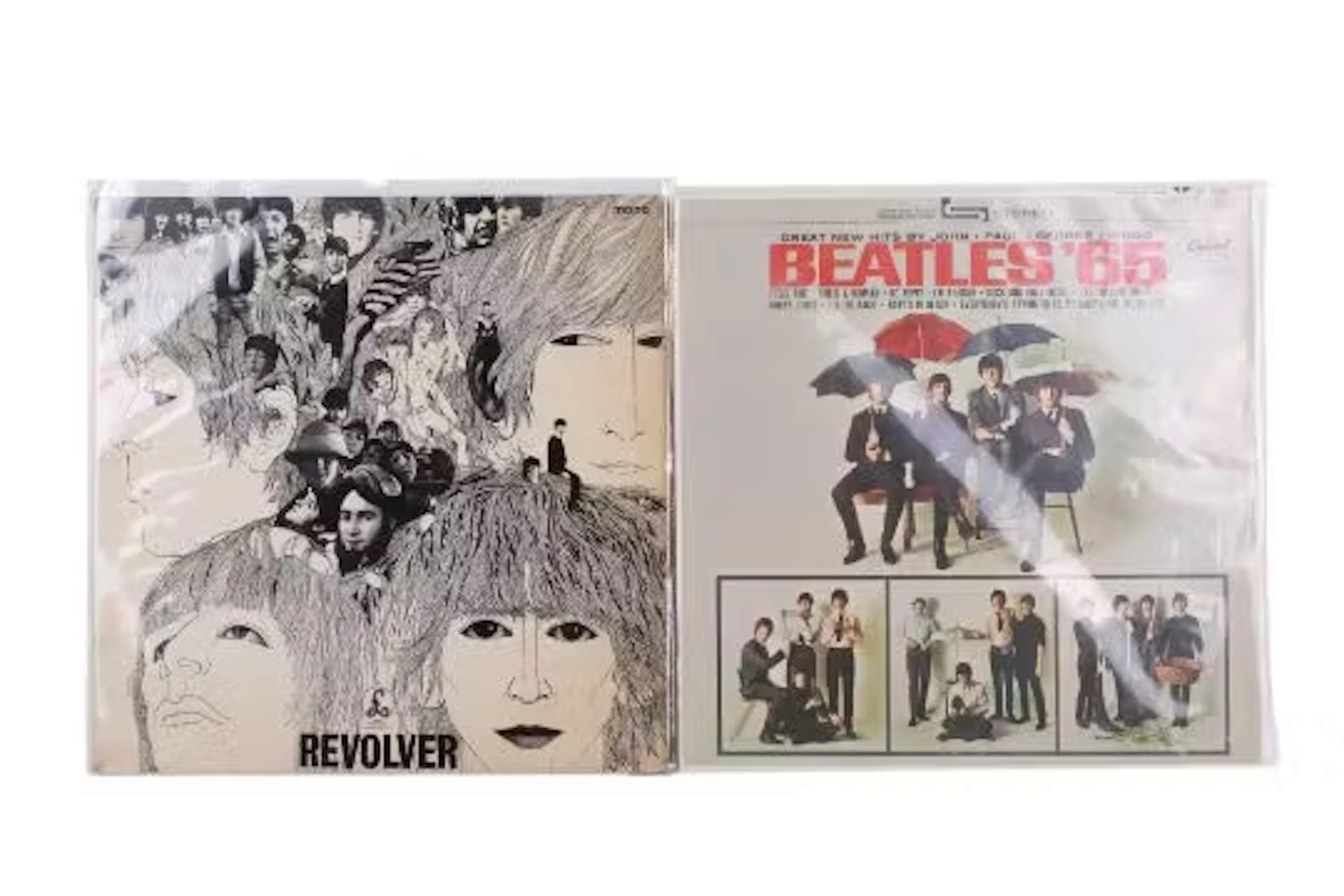 Two vintage Beatles vinyl LP album records.