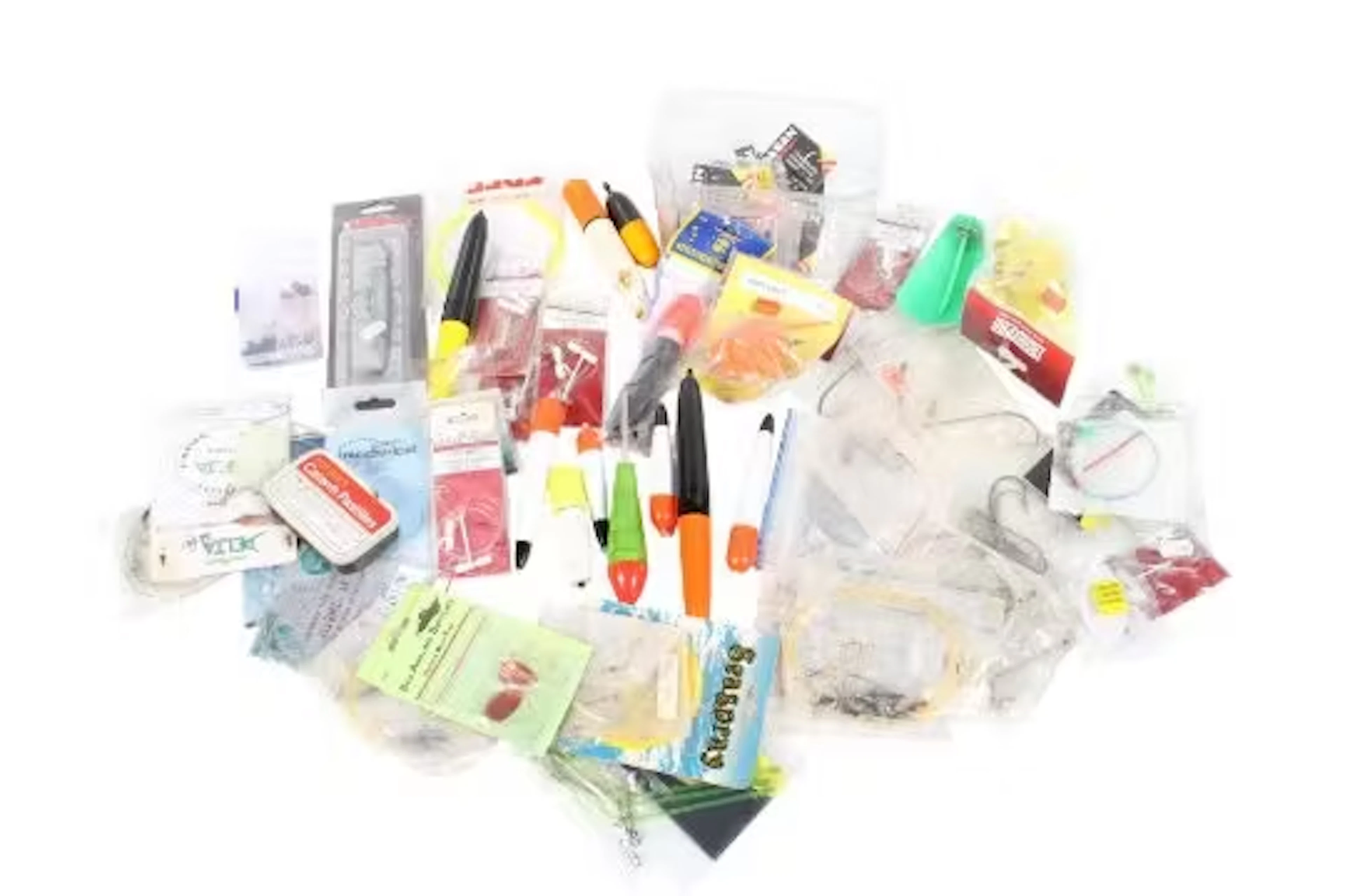 A box of mixed sea fishing tackle.