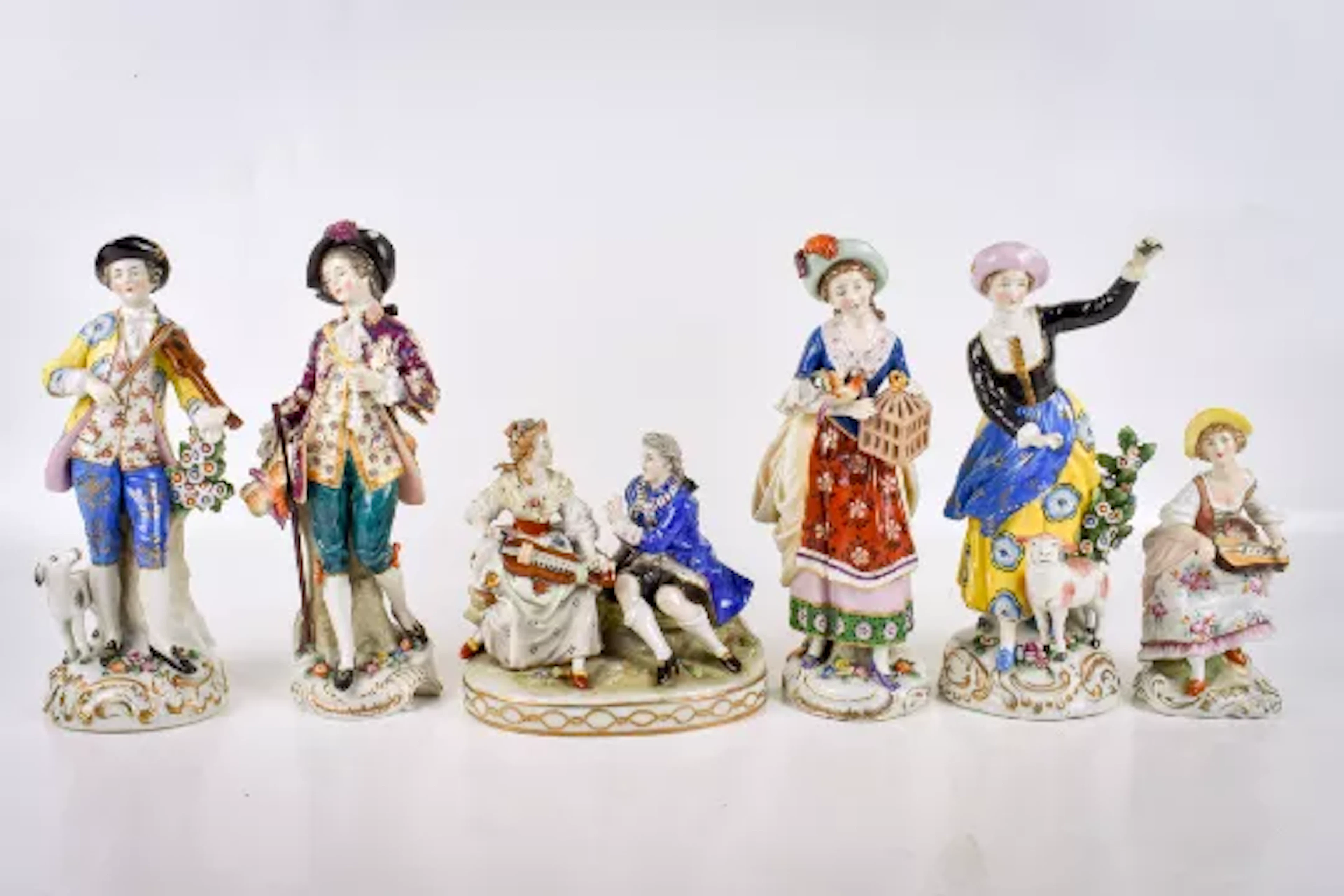 A group of six assorted Chelsea style porcelain figures.
