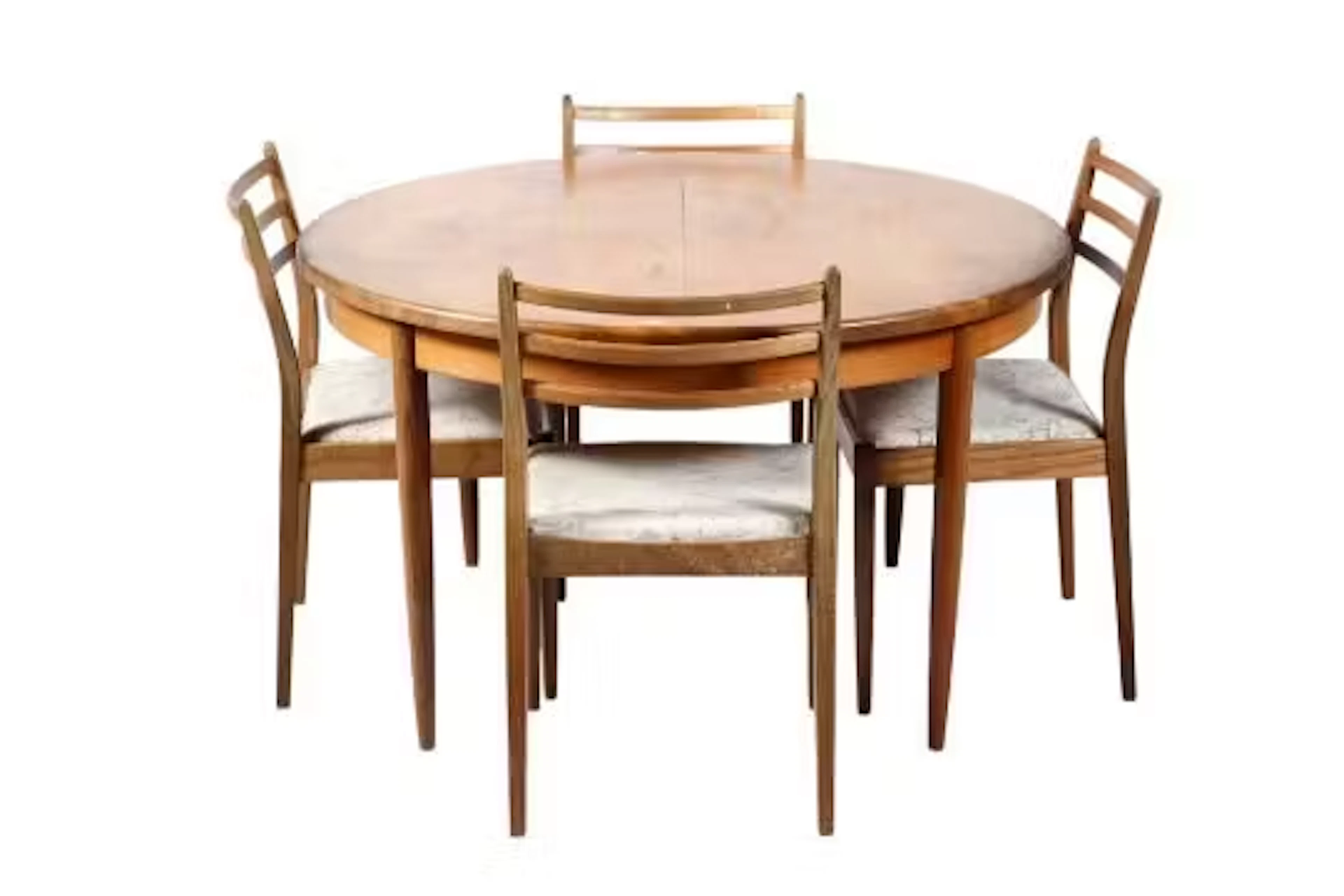 A G-Plan extendable dining table and four chairs.