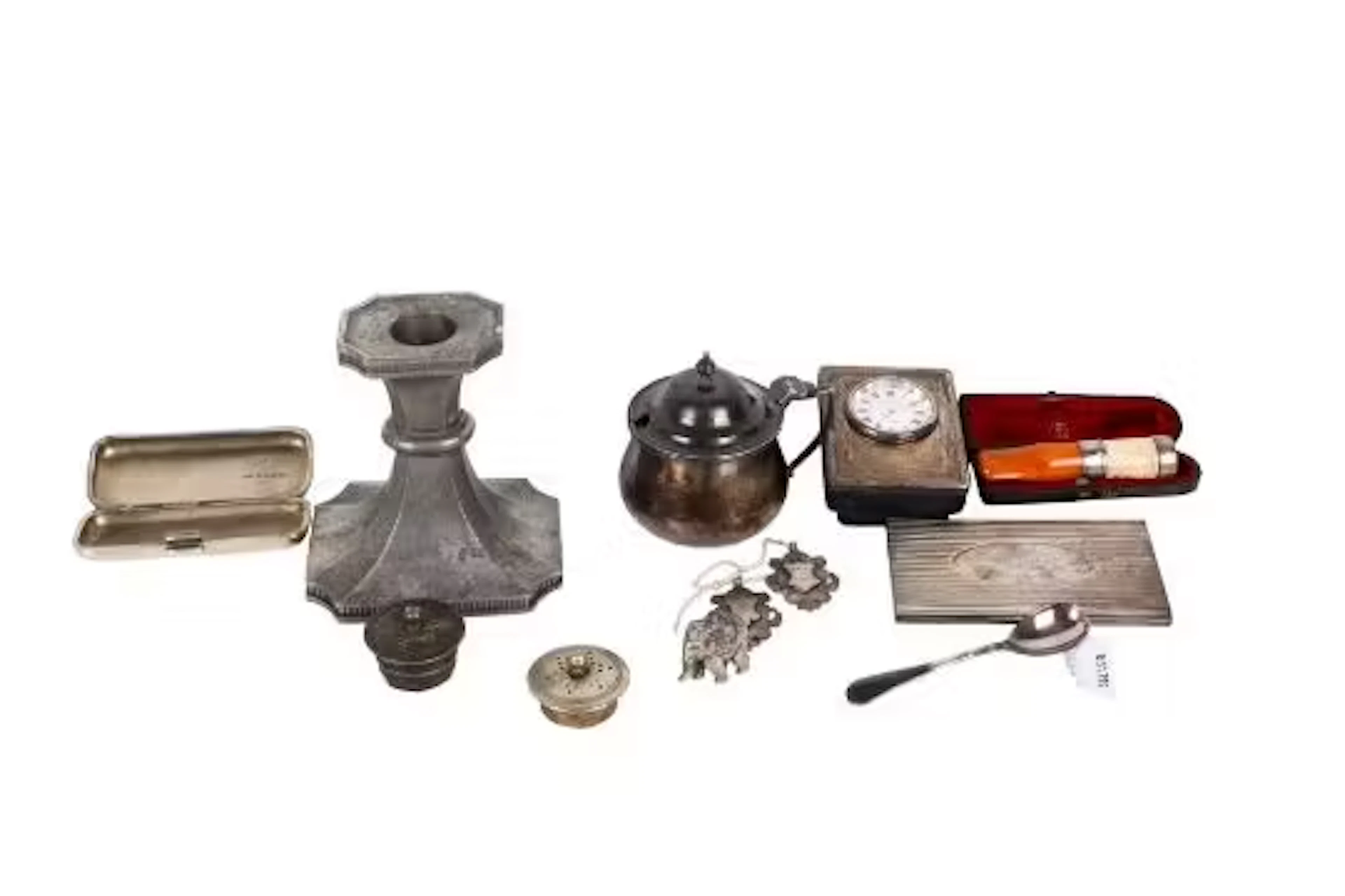 A small group of silver and metal table items.