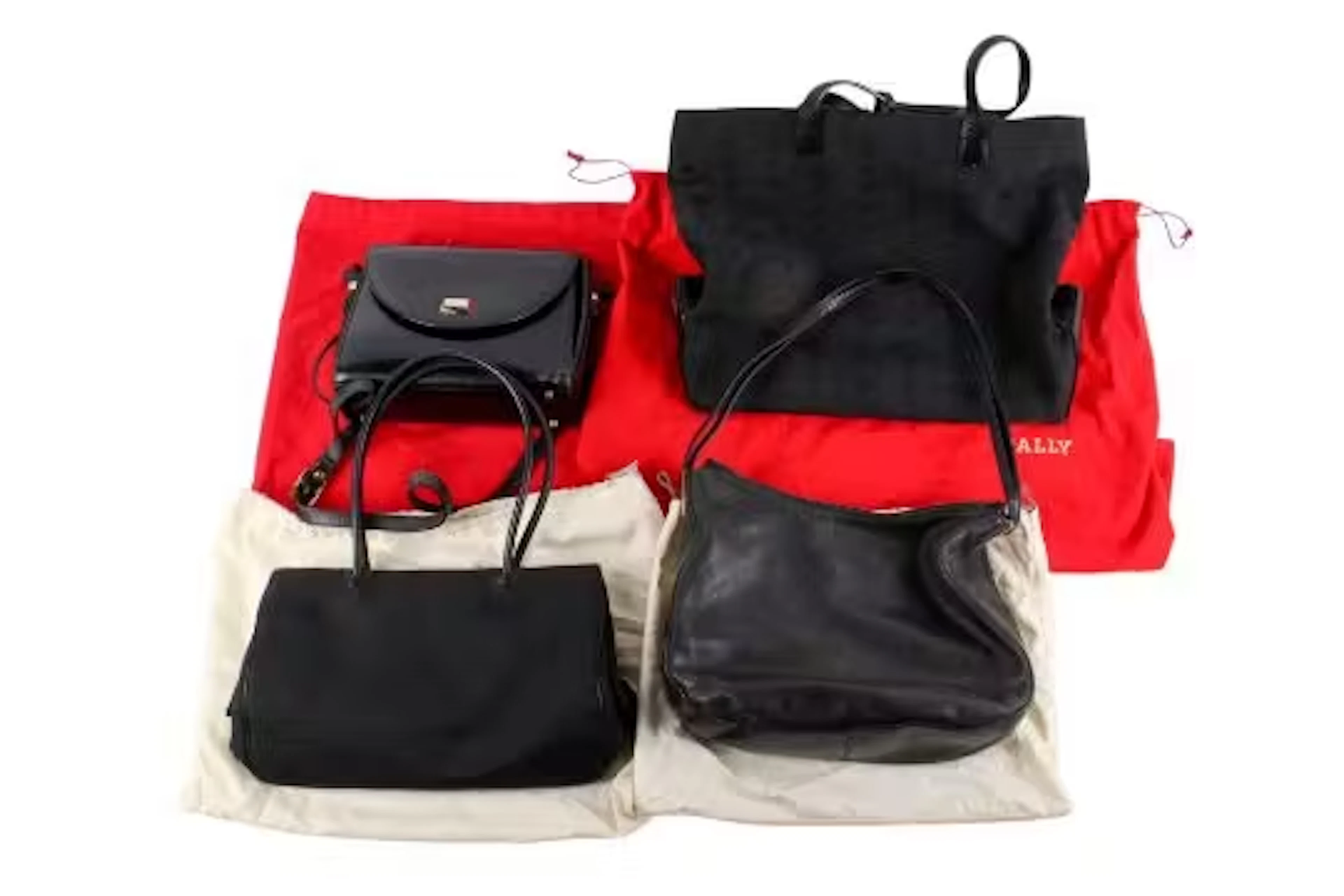 Four designer women's handbags. Some leather, including Bally, all