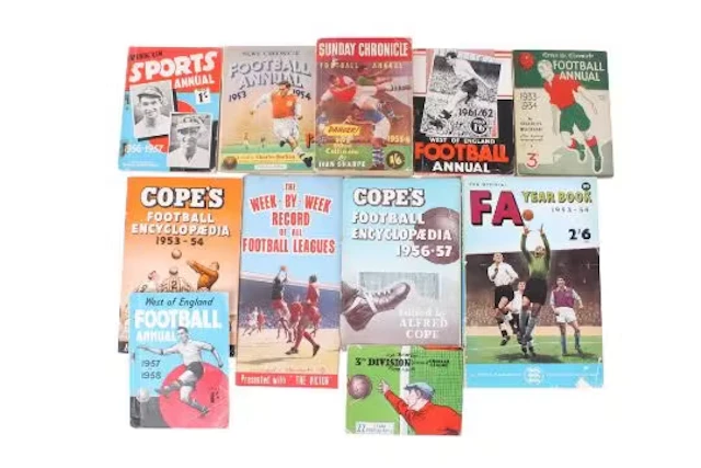 A collection of vintage football association yearbooks.