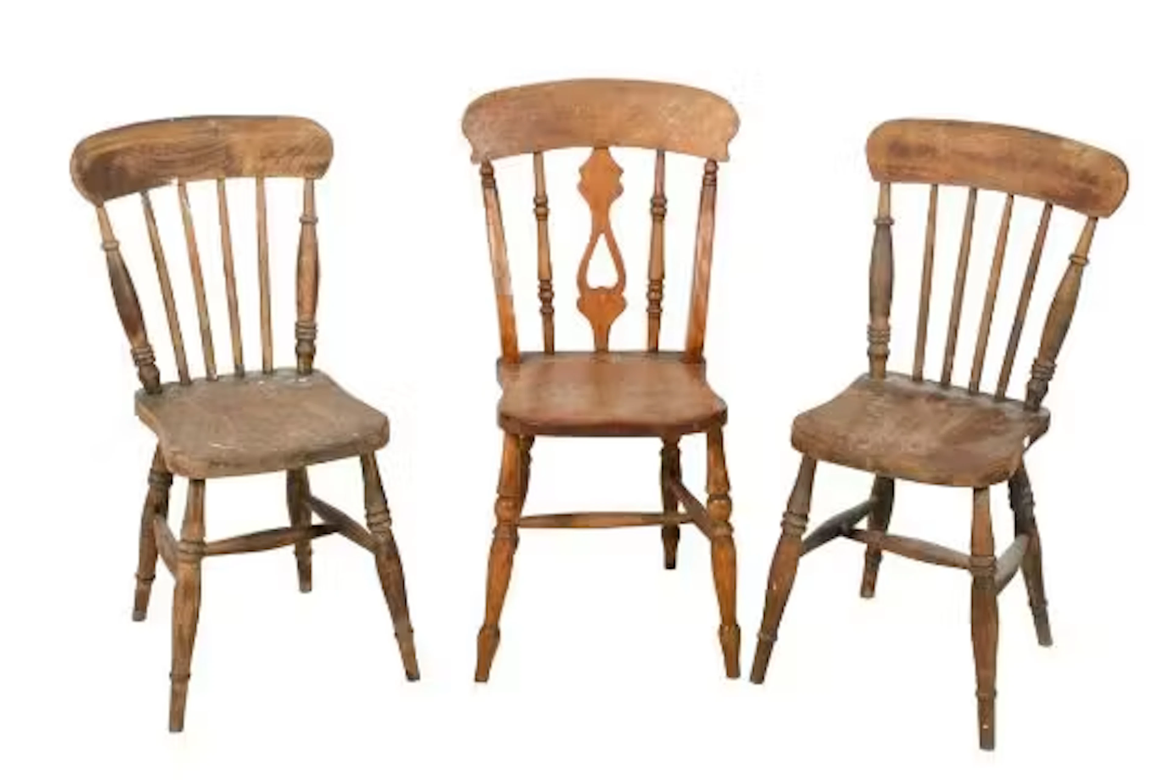 Three wooden Windsor style kitchen chairs.