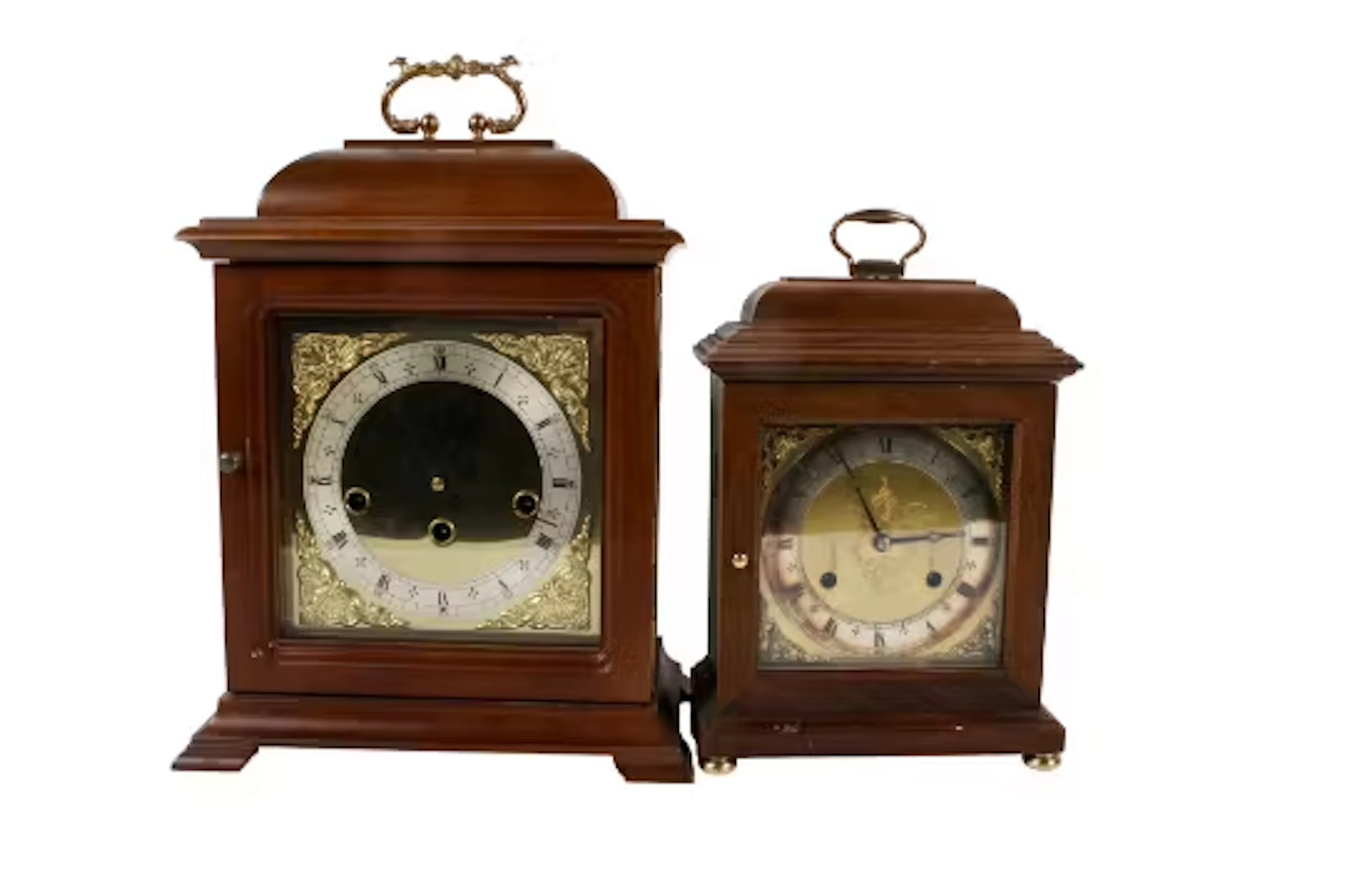 Two contemporary bracket style mantel clocks. One chiming and one