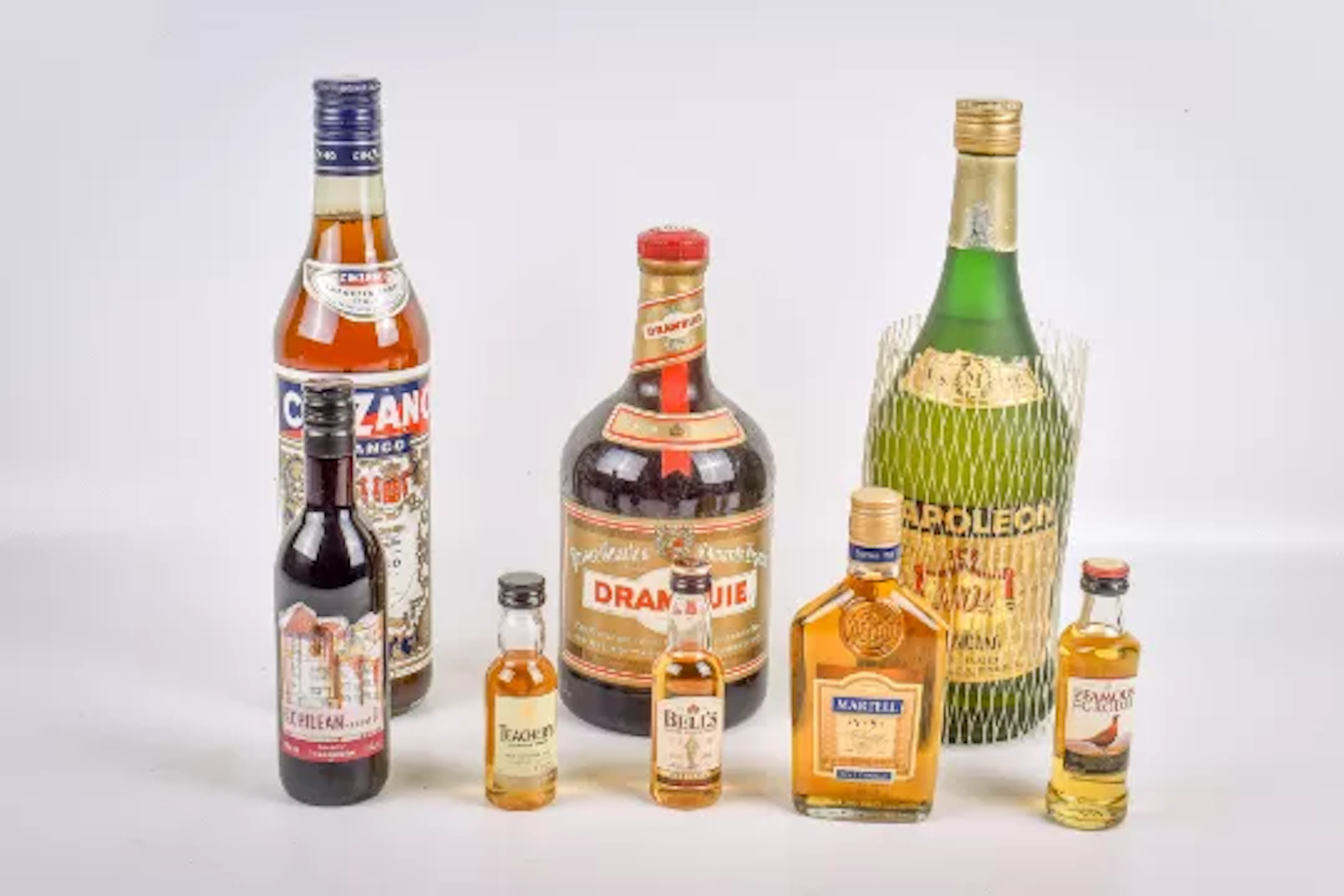 Eight assorted bottles of alcohol.
