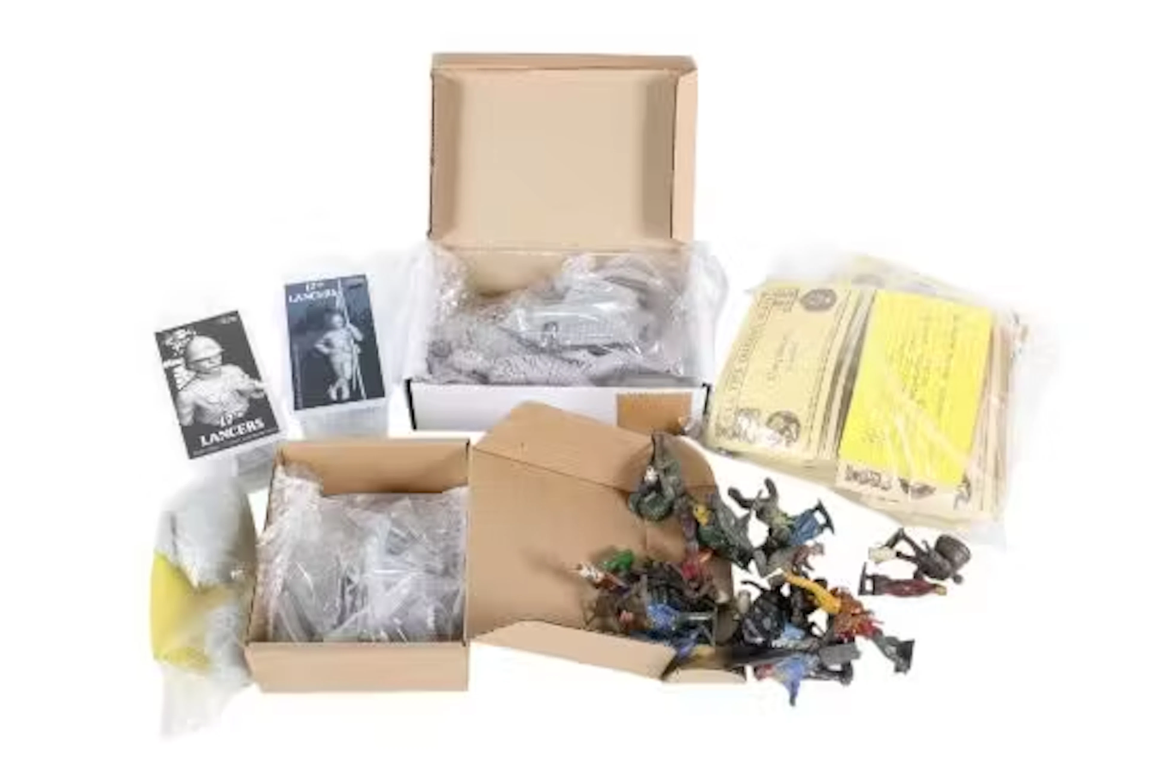 An assortment of unconstructed metal and resin kits.