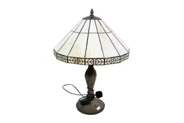 Tiffany style table lamp with a leaded glass shade.