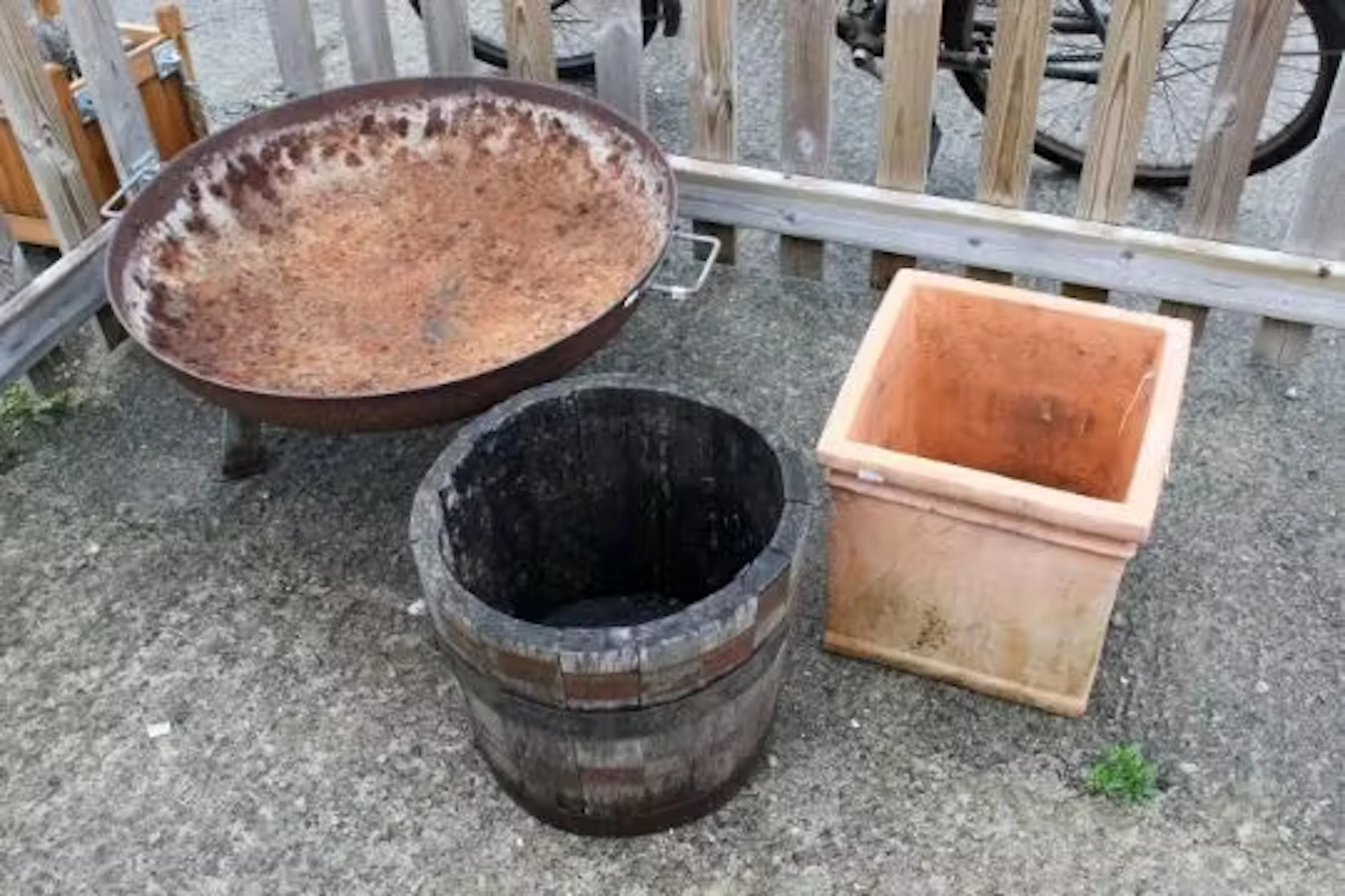 Two garden planters and a metal fire pit.