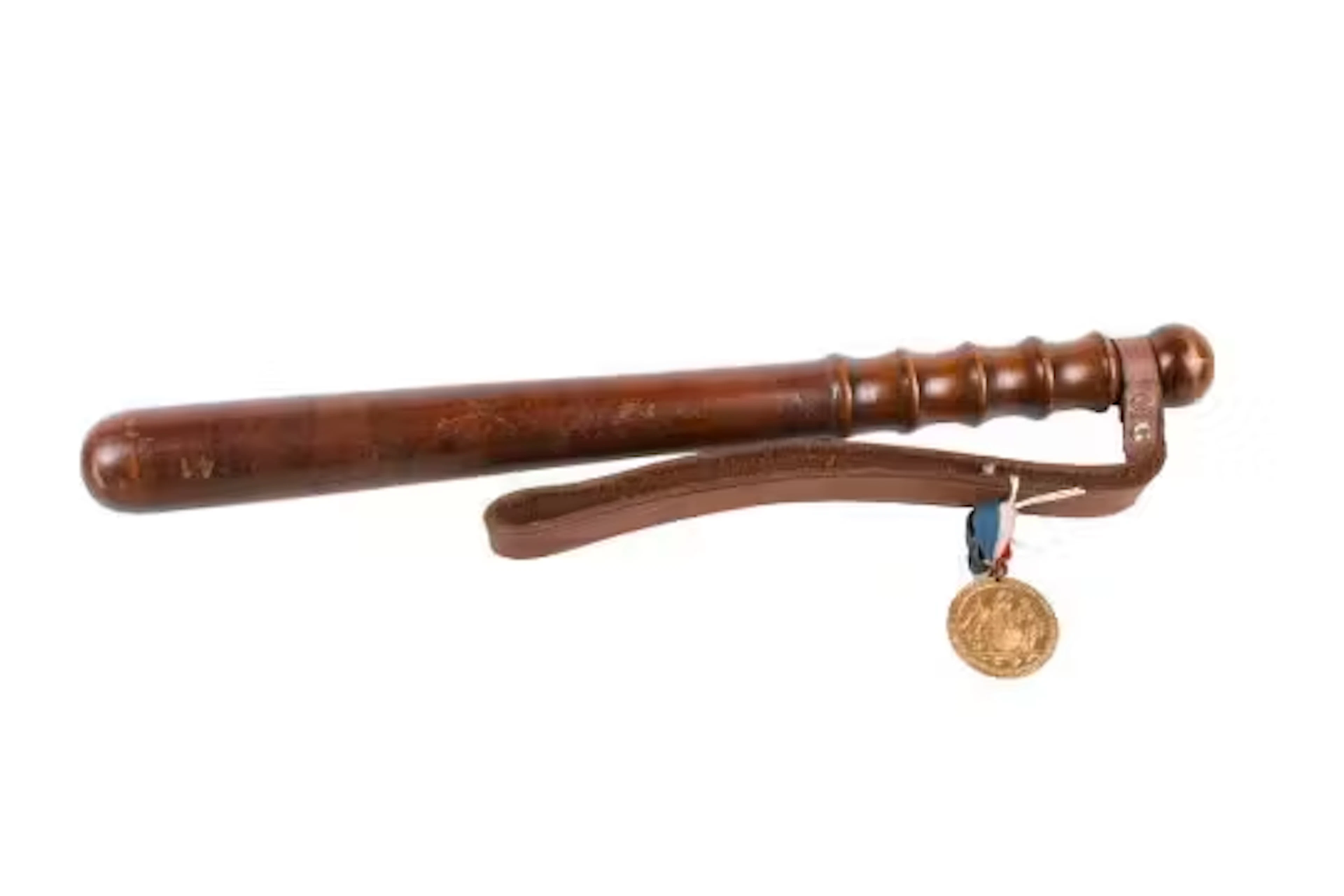 An early 20th century truncheon and a WWI Birmingham Peace Medal.