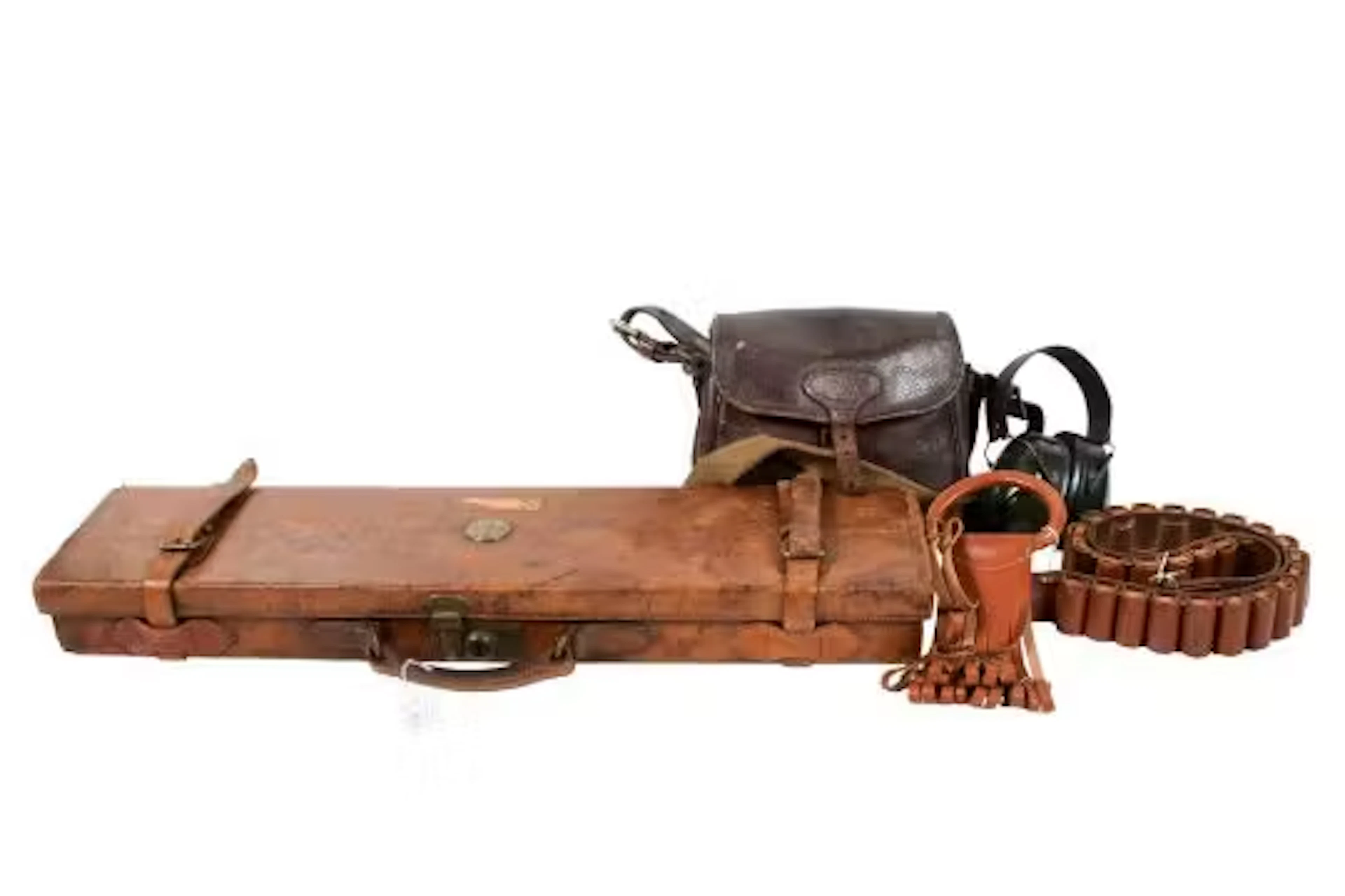 Vintage leather shot gun case with other shooting accessories. Including