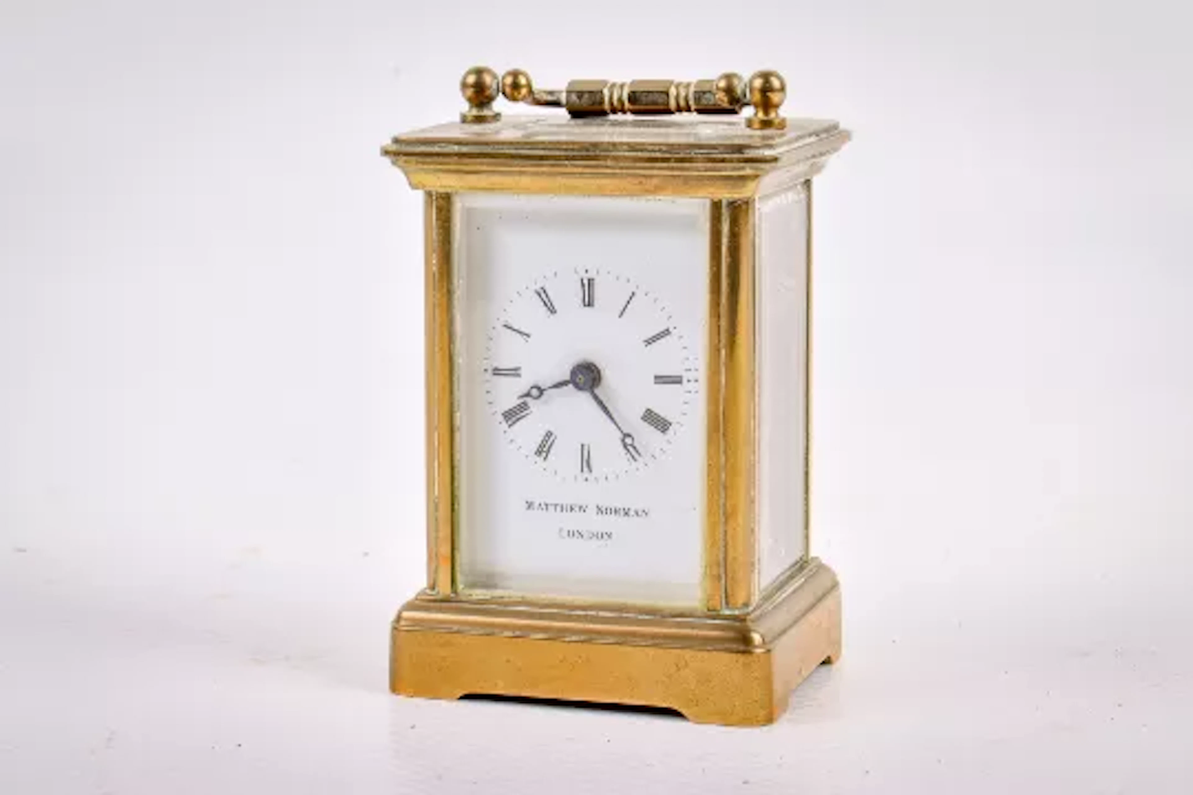 A Matthew Norman miniature five glass brass carriage clock (af).