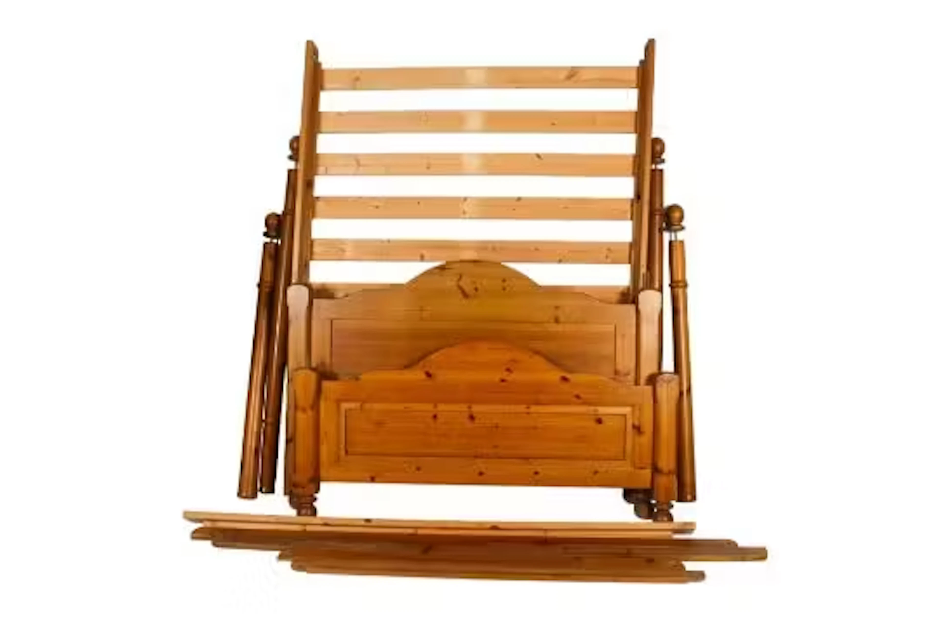 A contemporary pine four poster double bed.