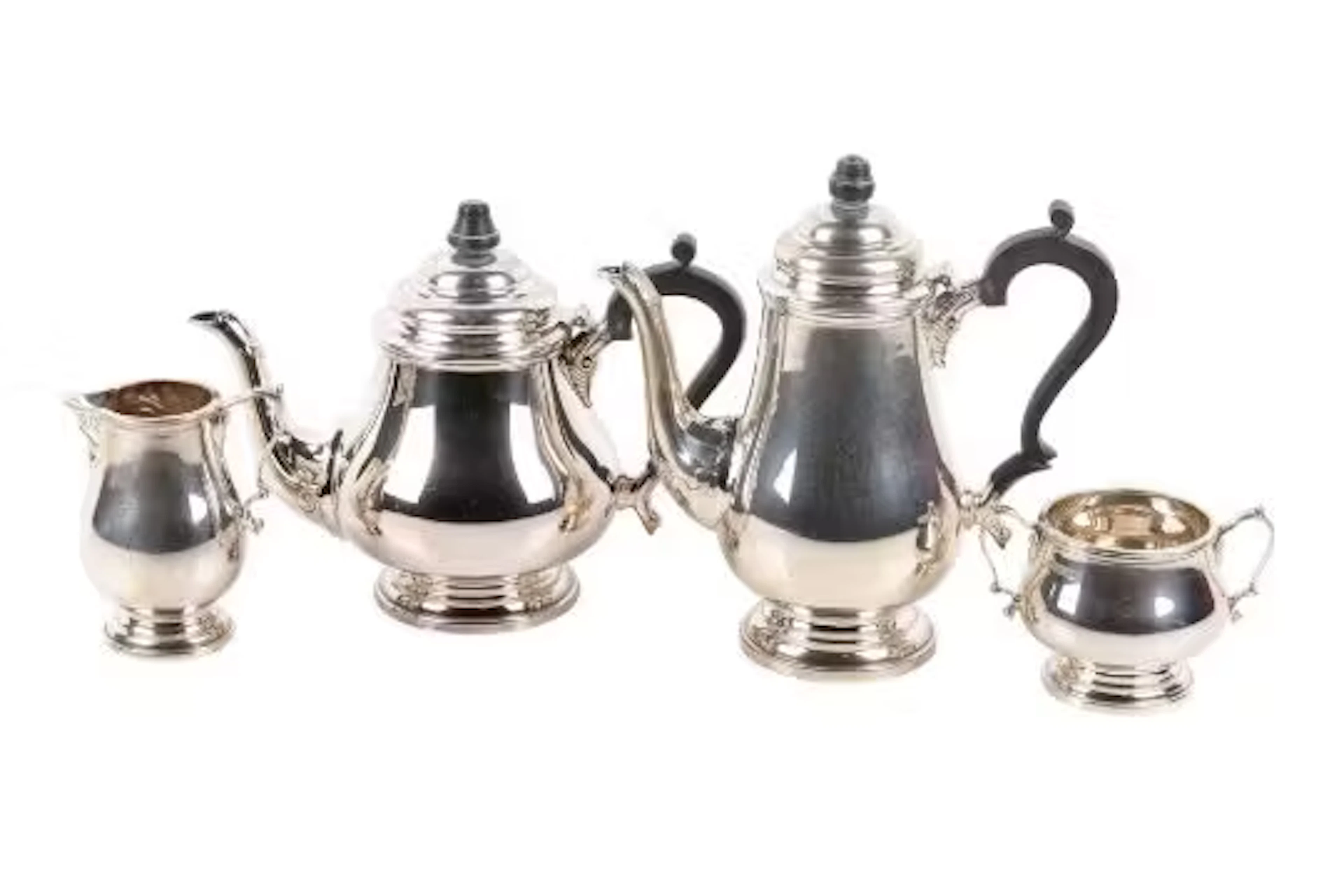 An Elizabeth II silver four-piece tea and coffee set.