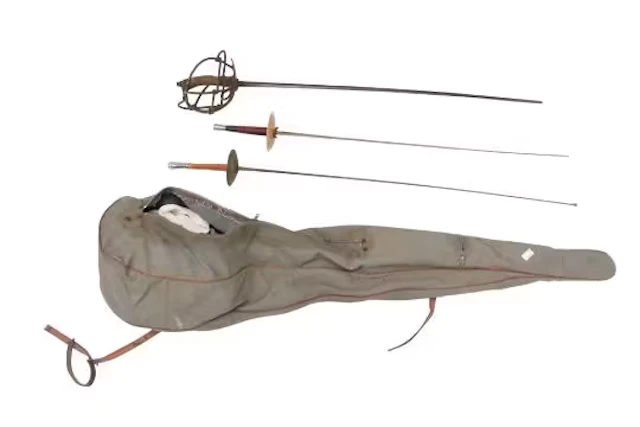 A group of vintage 'modern' fencing equipment. Including a helmet