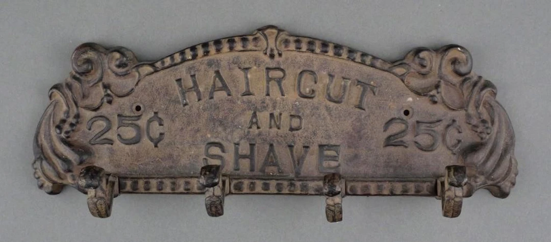 Cast Iron "Haircut and Shave 25c" Coat Rack