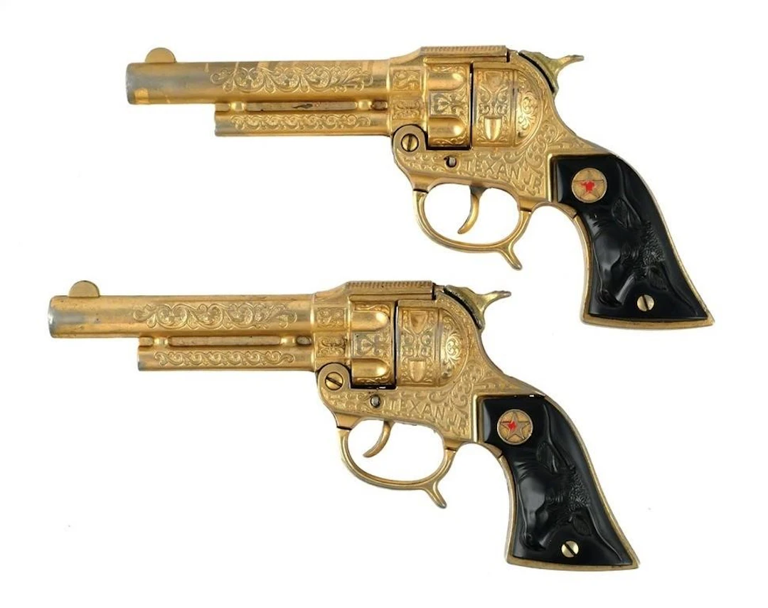 (2) Hubley Texan Jr. Gold Cap Guns & Holsters