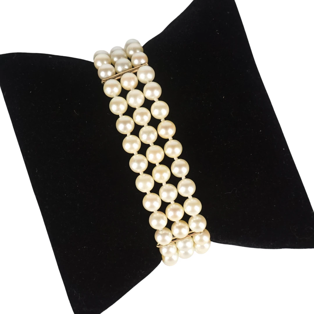 Élégant bracelet trois rangs de perles blanches (D