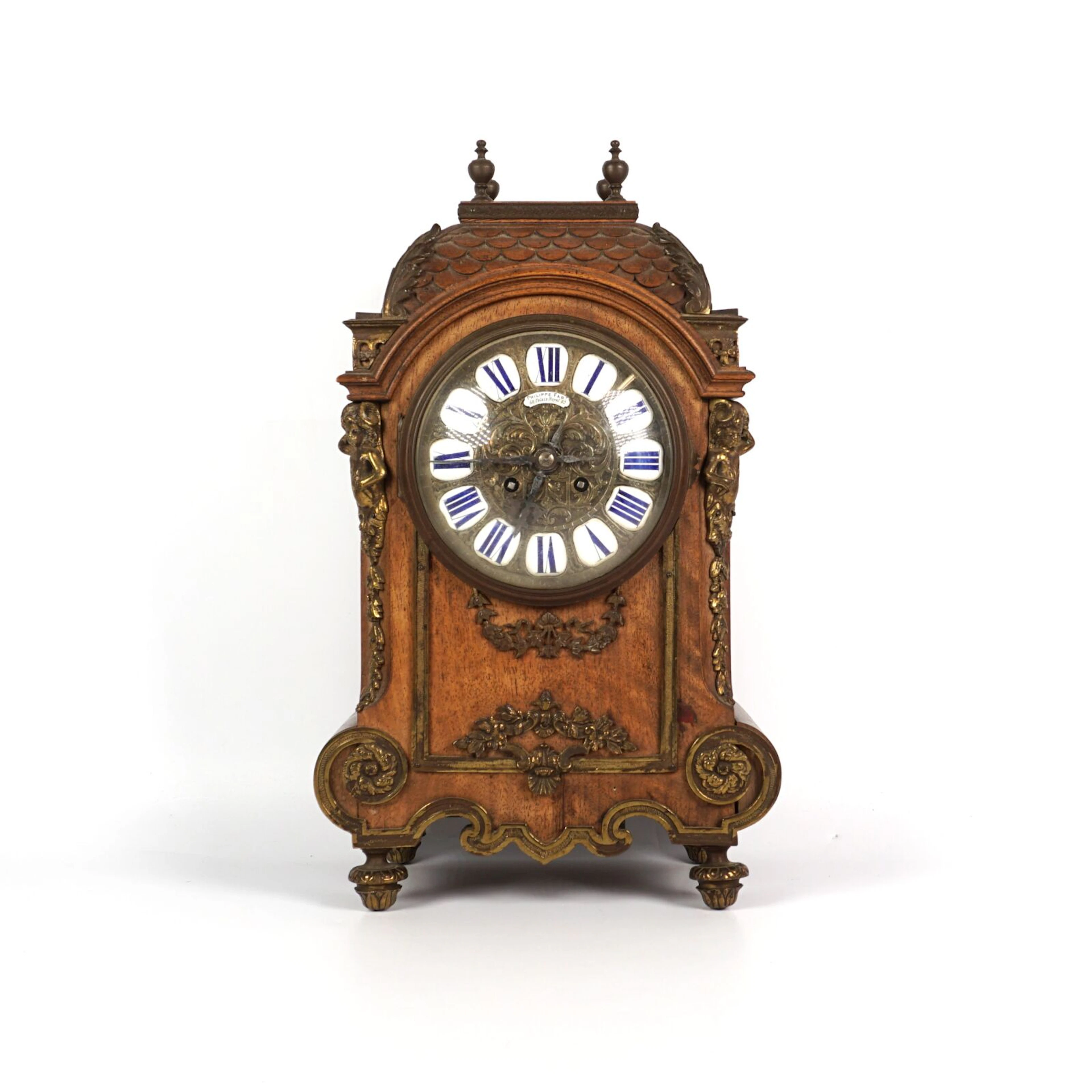 Pendule à poser en bois et bronze doré