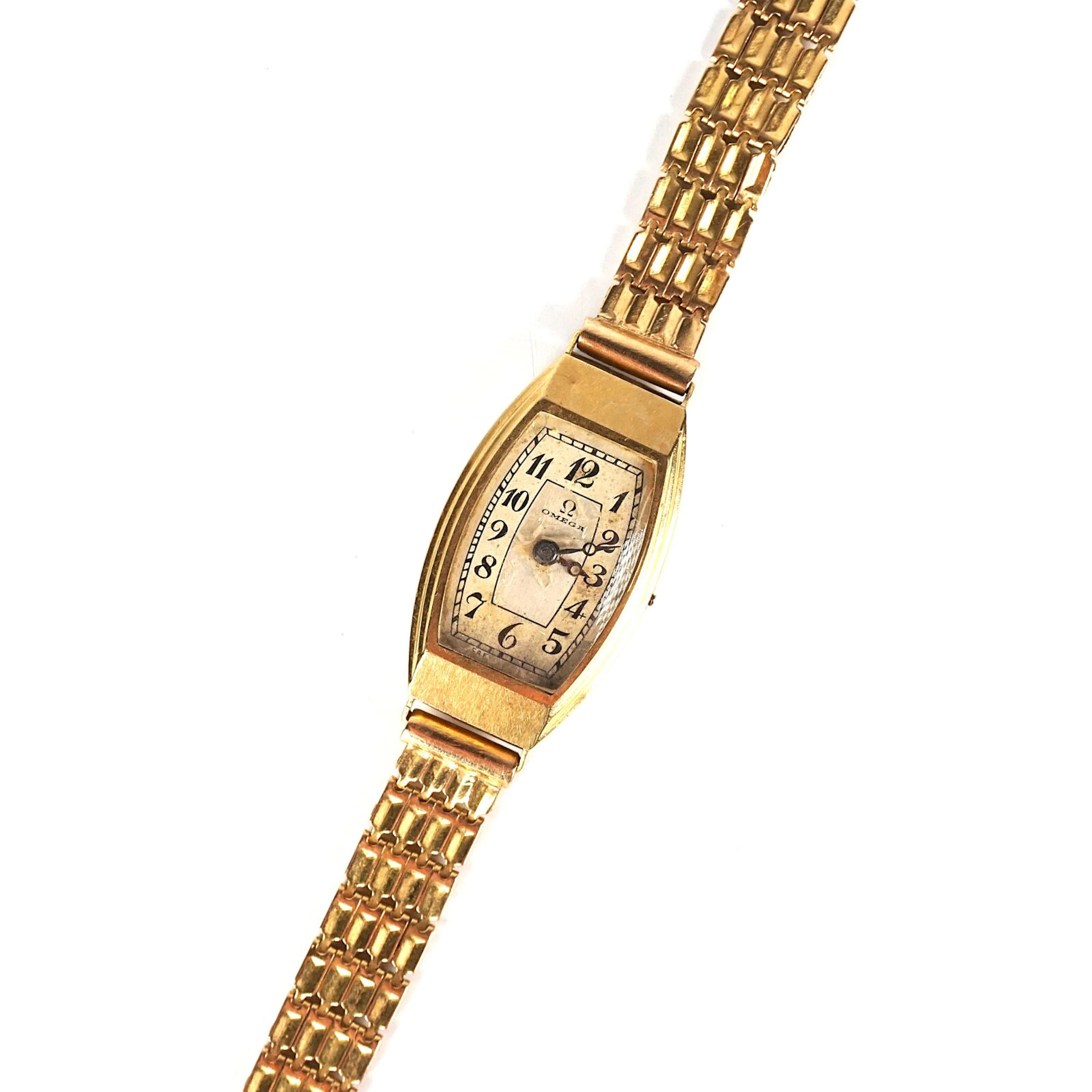 OMEGA : Montre bracelet de dame en or jaune 18K (750/oo)