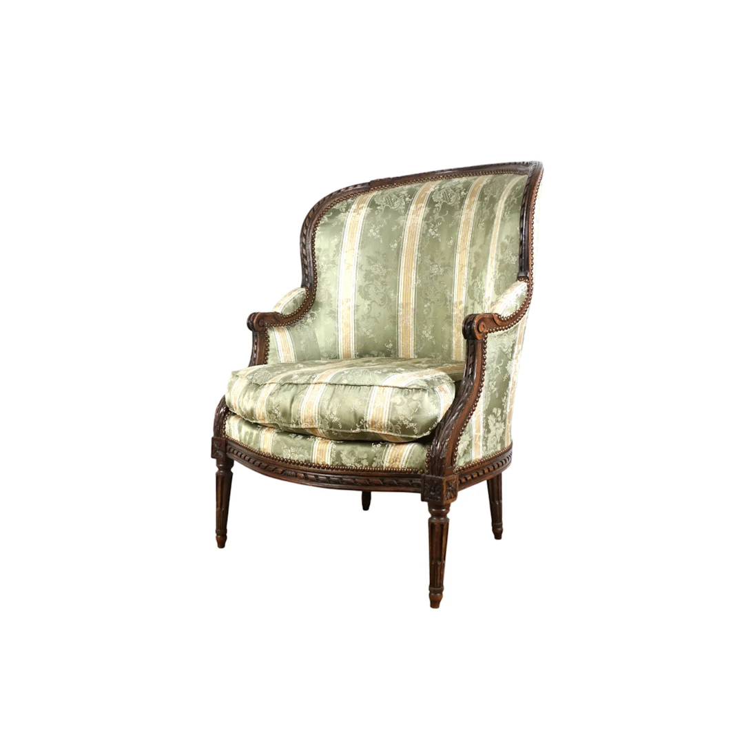 Bergère en bois mouluré et sculpté