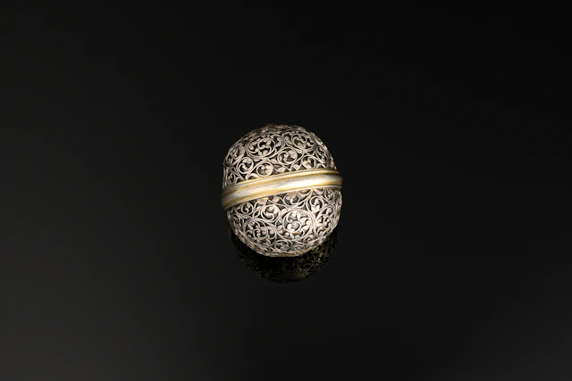 A little Indo-Portuguese bezoar stone holder, silver and parcel gilt