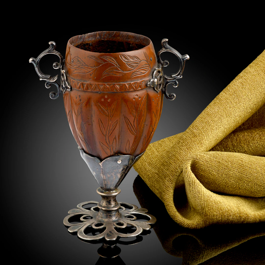 A Spanish Colonial silver mounted Cocquilla nut goblet engraved with