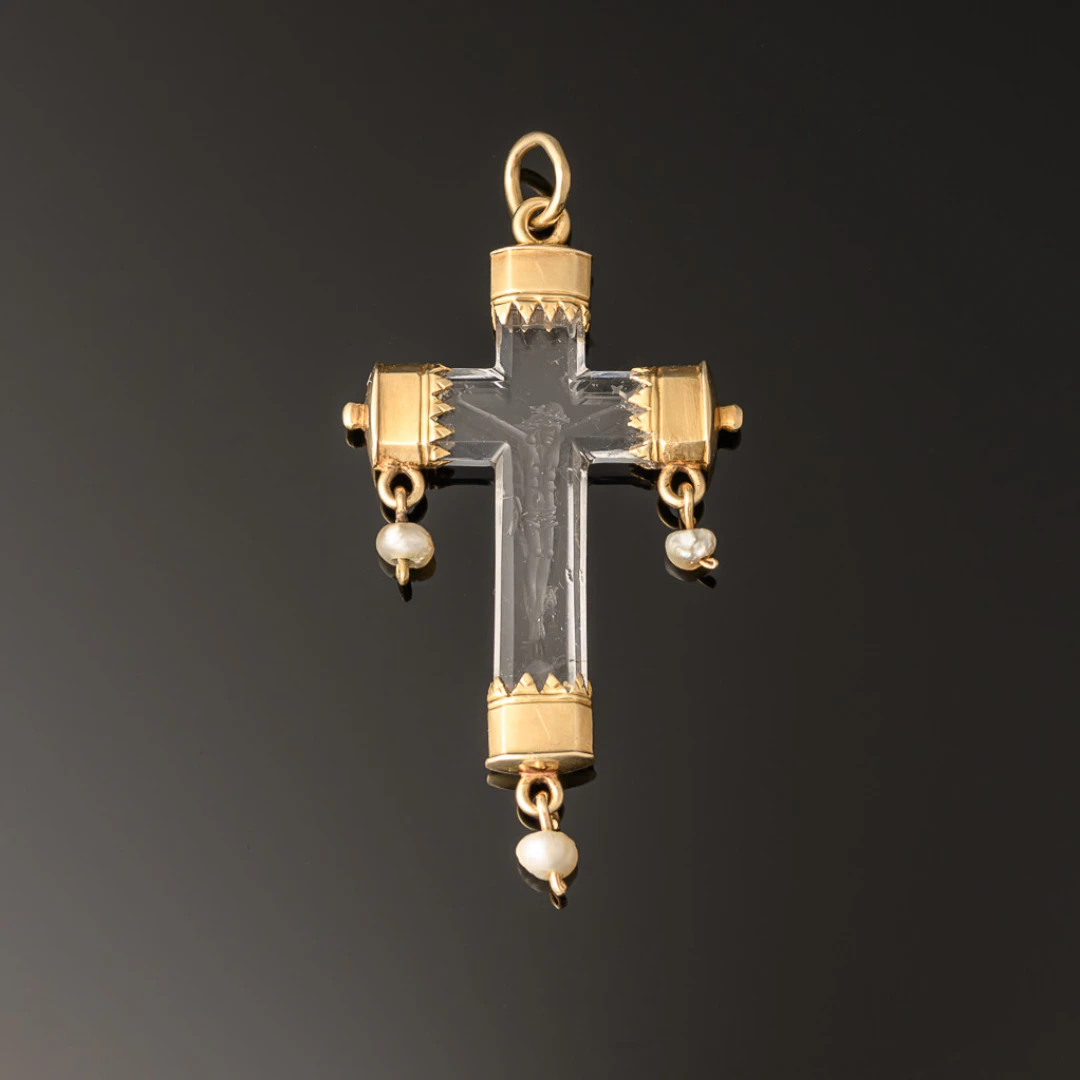 A rock crystal devotional pendant, consisting of a crucifix with gold