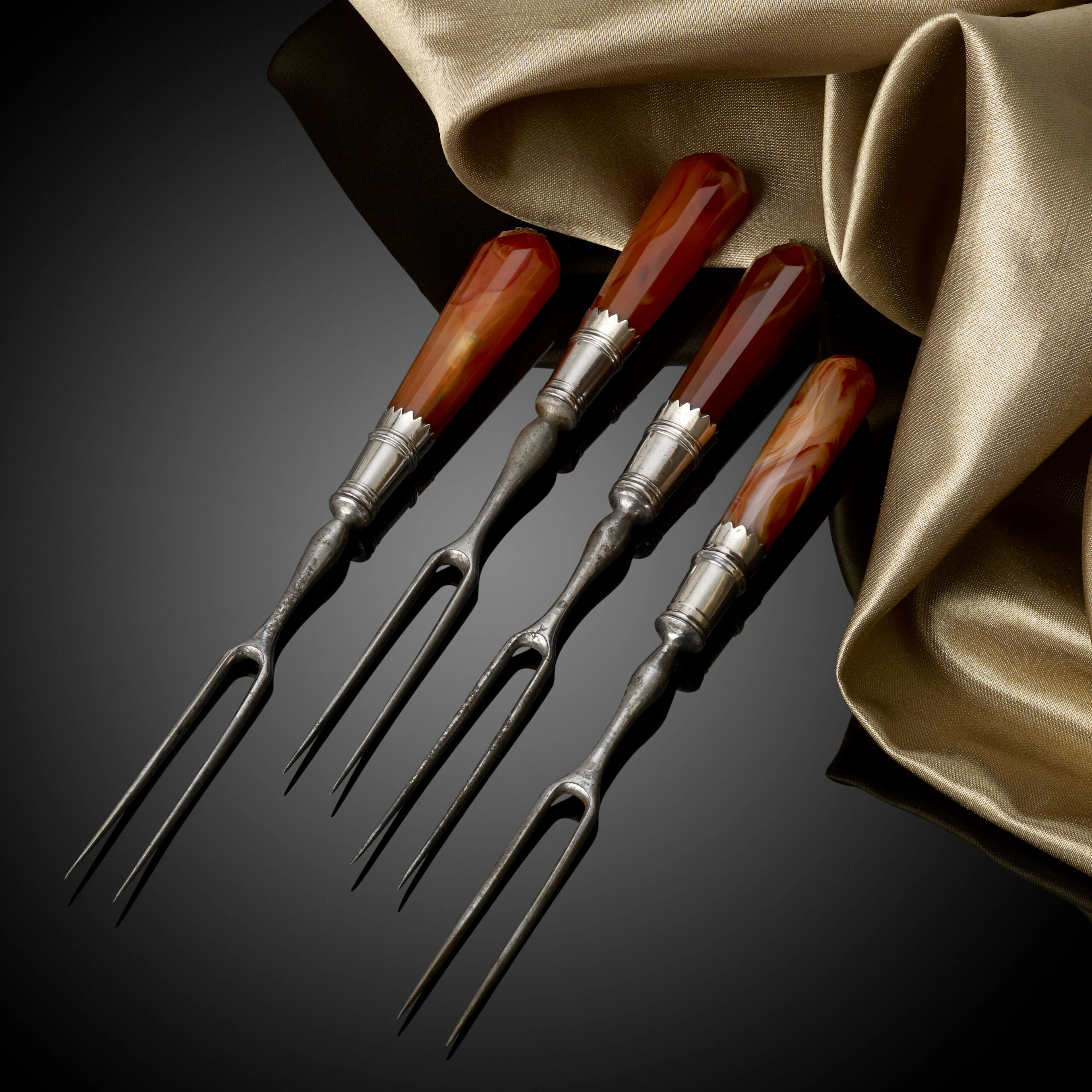 A rare set of four 17th Century William & Mary sweetmeat forks