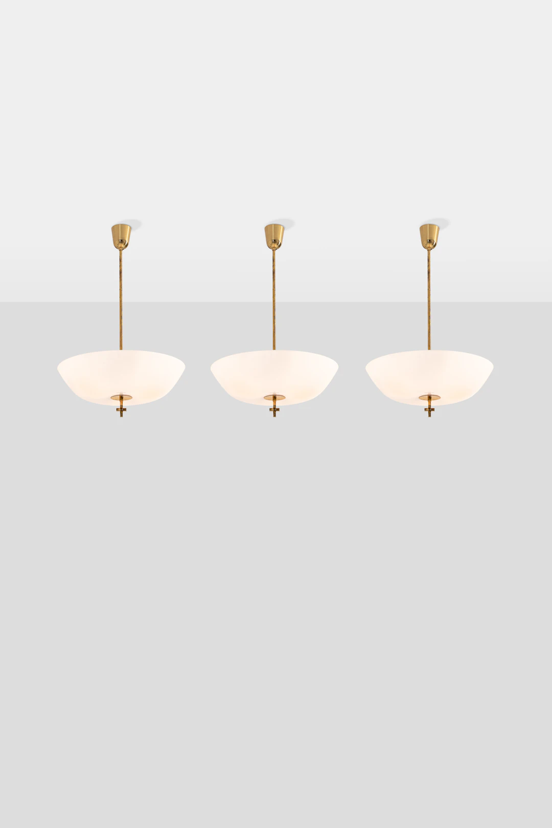 xx Paavo Tynell (1890-1973) Set of three pendant lights