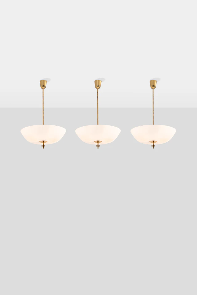 xx Paavo Tynell (1890-1973) Set of three pendant lights
