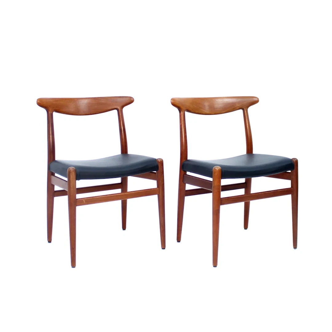 Hans Wegner, pair of Teak and leather dining chairs, model W2 for