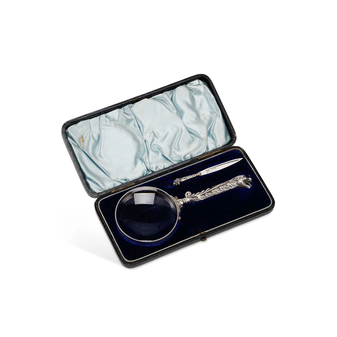 A LATE VICTORIAN SILVER-MOUNTED MAGNIFYING GLASS AND SILVER BOOKMARK SET