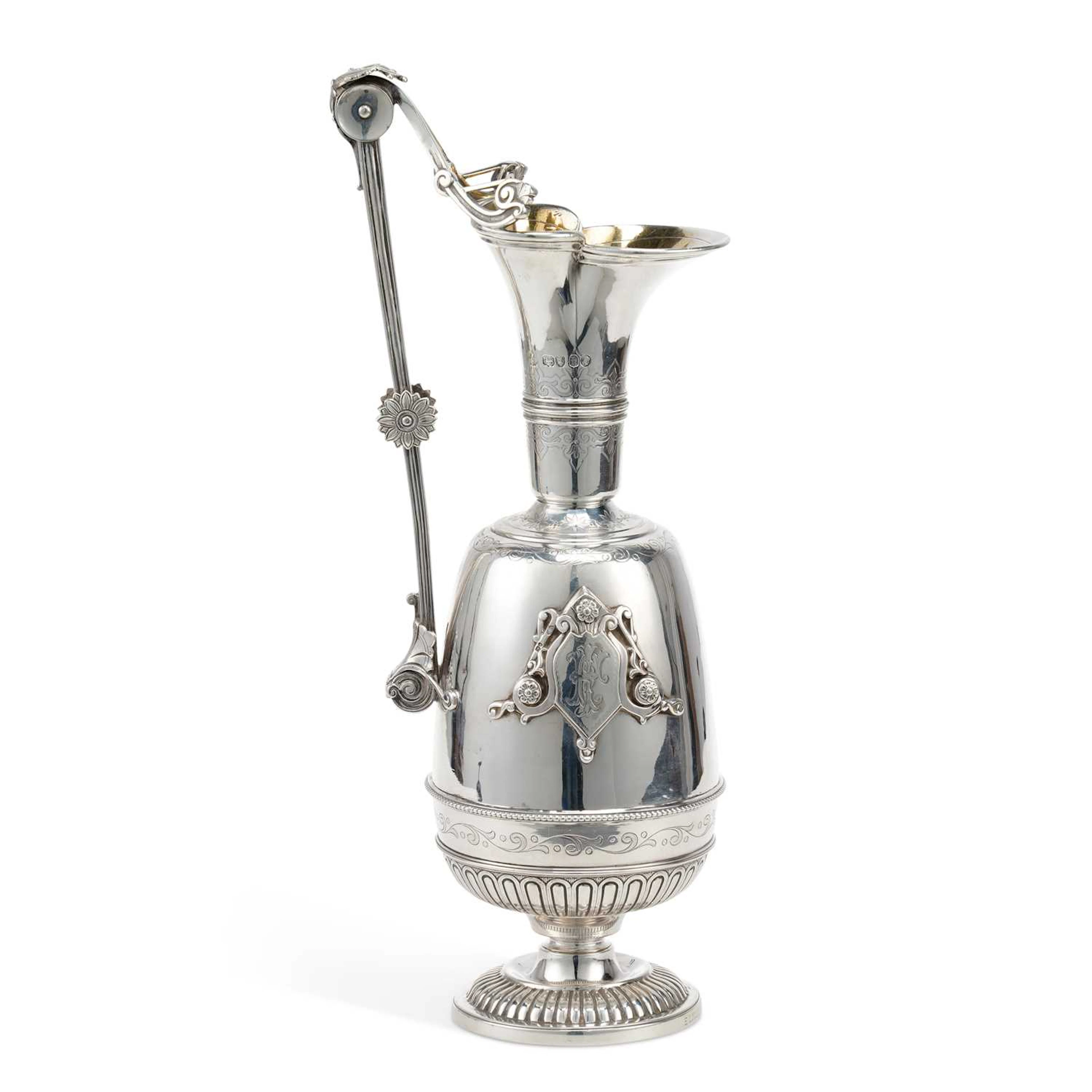 A LARGE VICTORIAN SILVER WATER JUG OR WINE EWER