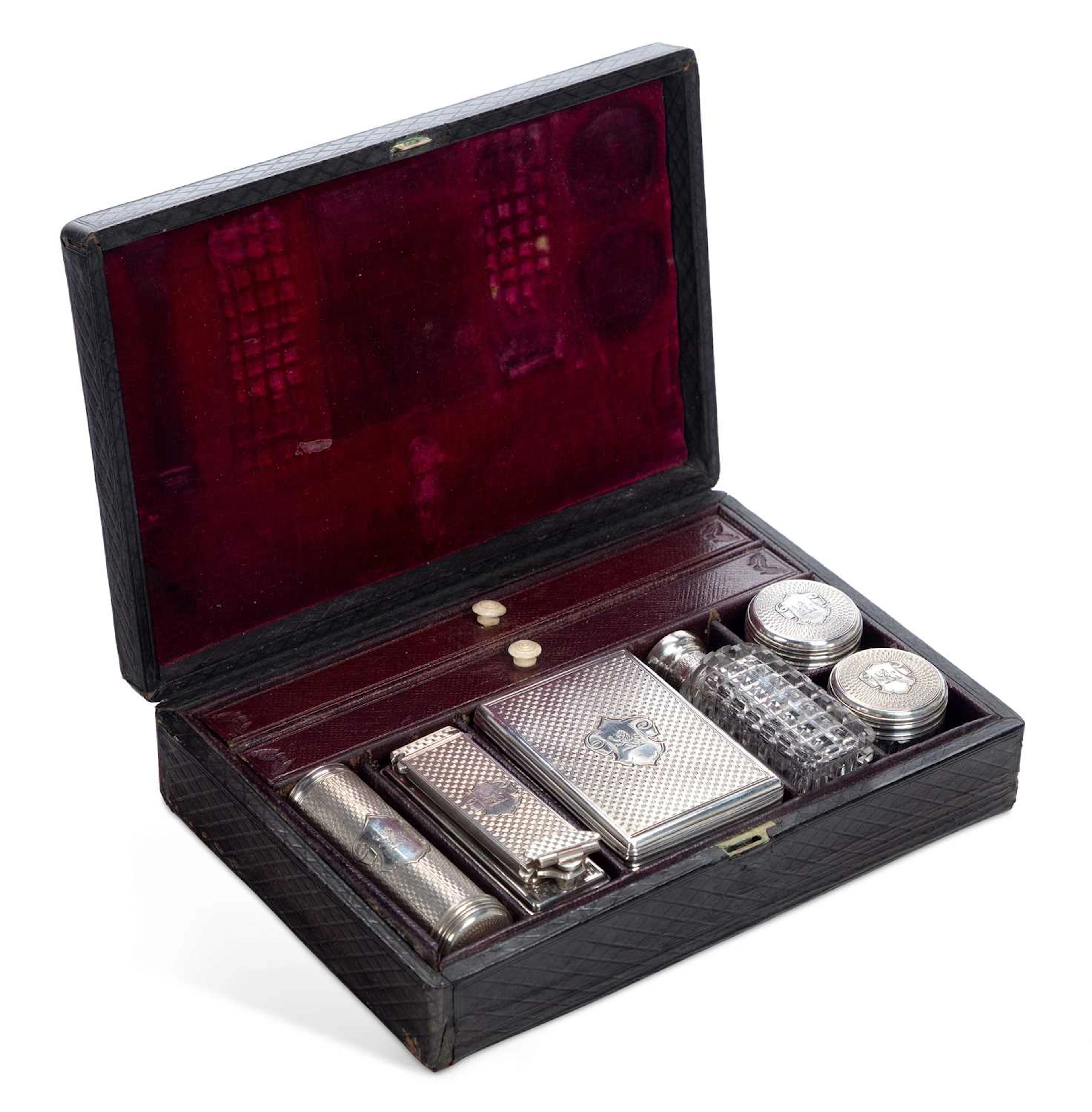§ A VICTORIAN SILVER COVERED GENTLEMAN'S TRAVELLING VANITY SET
