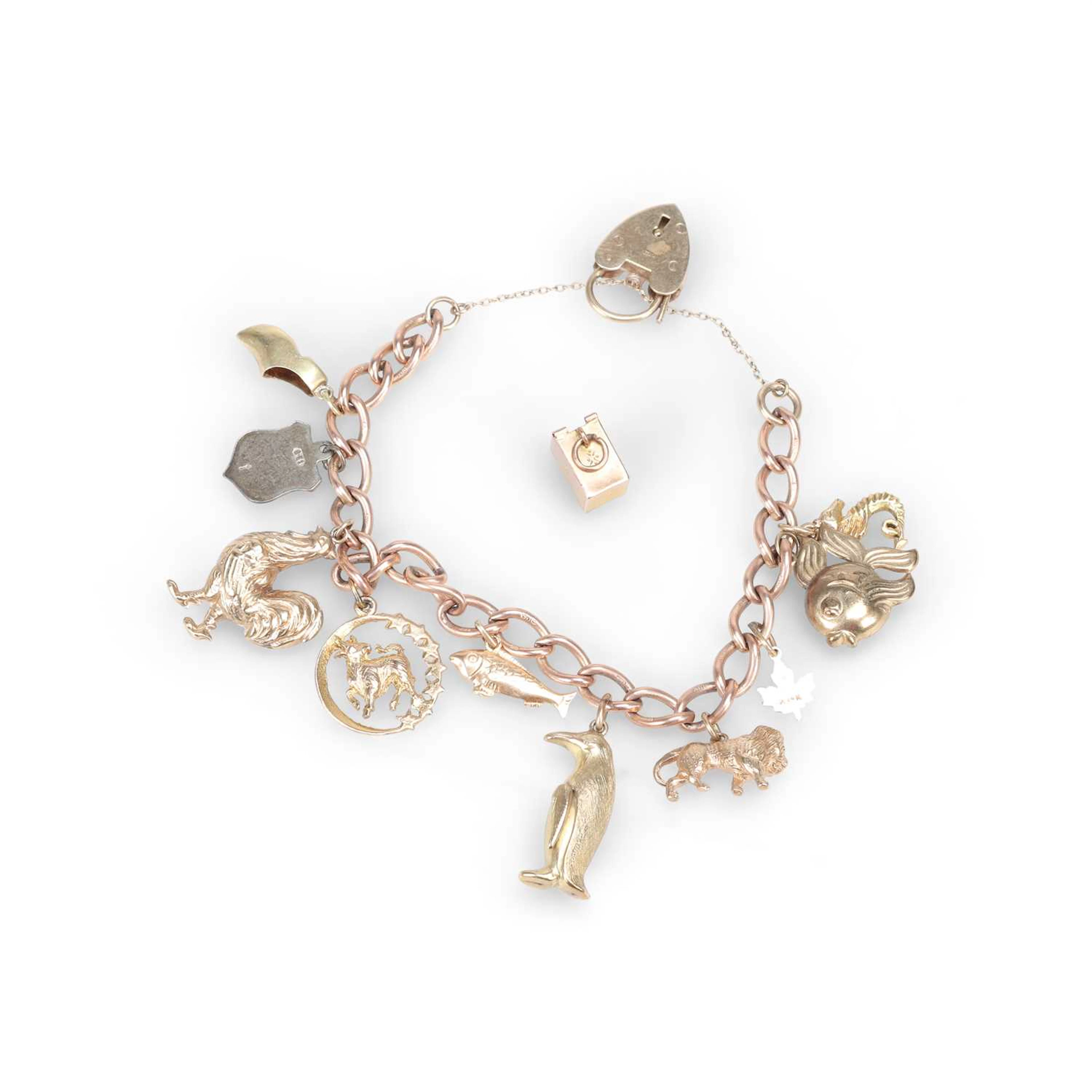 A 9 CARAT GOLD CHARM BRACELET