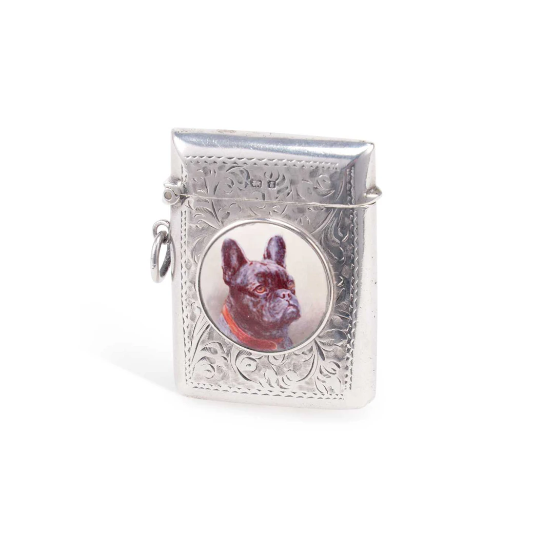 AN EDWARDIAN SILVER AND ENAMEL VESTA CASE
