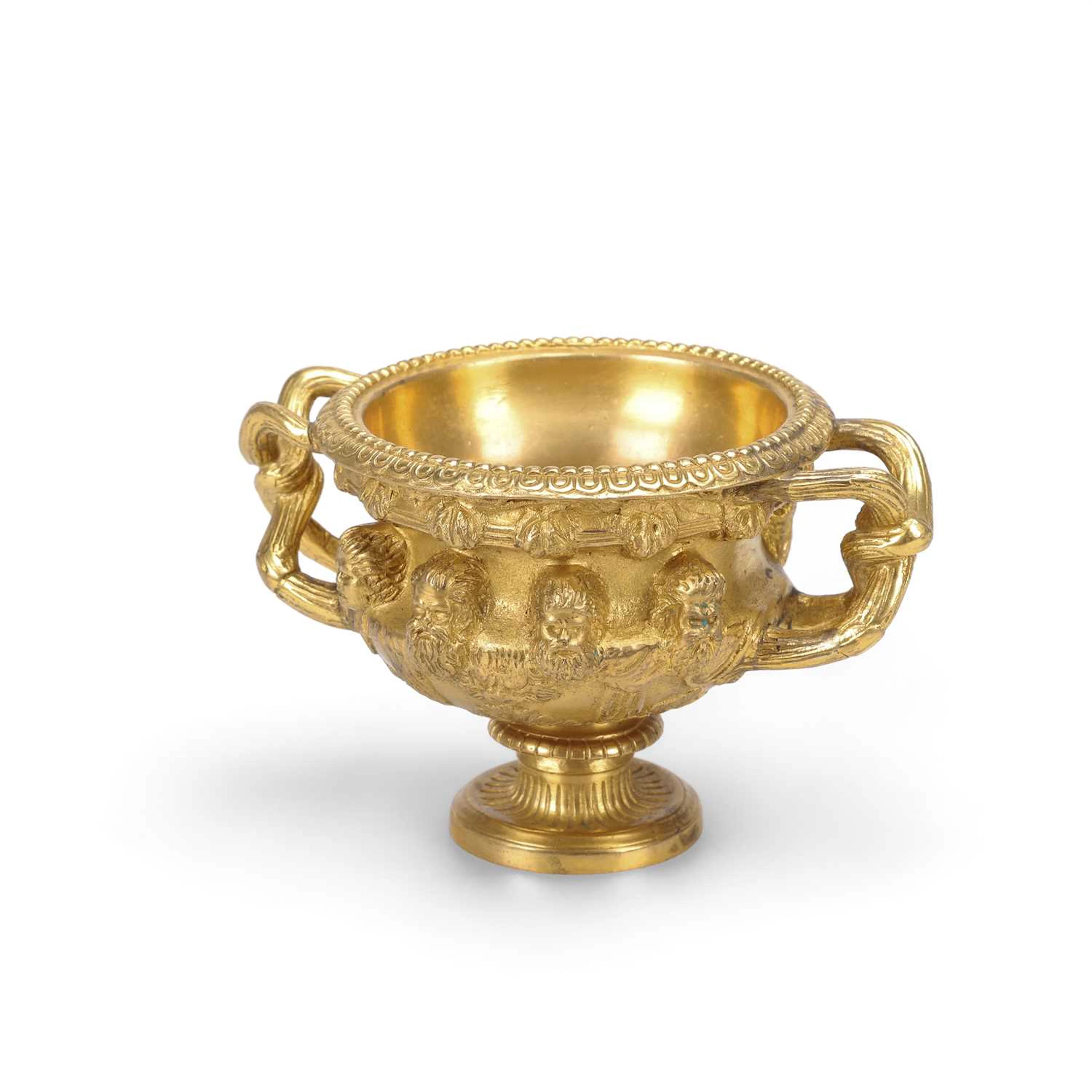 A MINIATURE GILT-METAL MODEL OF THE WARWICK VASE