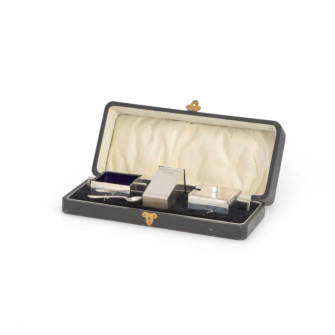 AN ART DECO SILVER THREE-PIECE CONDIMENT SET