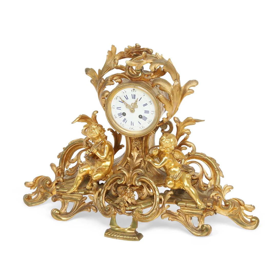A FRENCH GILT BRONZE FIGURAL MANTEL CLOCK