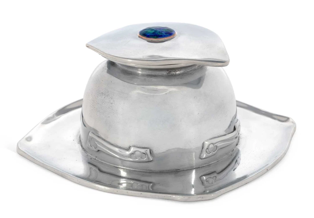 A LIBERTY & CO TUDRIC PEWTER AND ENAMEL INKWELL CIRCA 1910