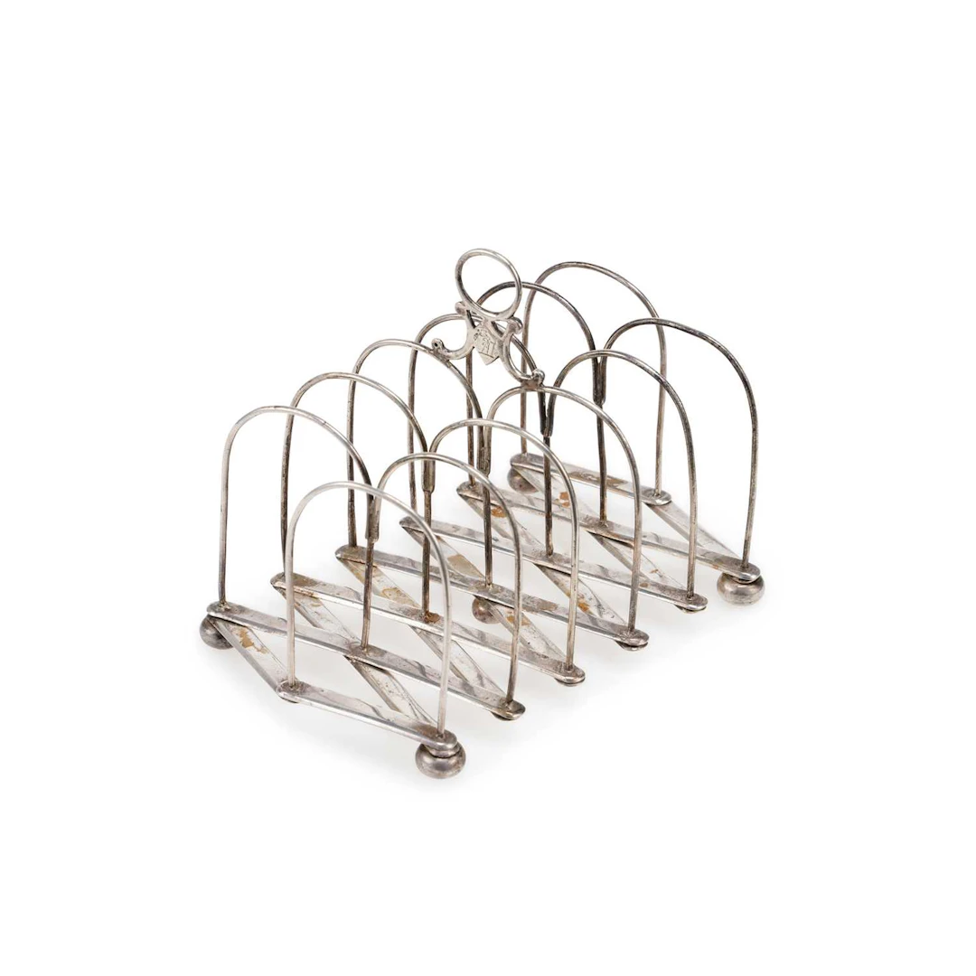AN INDIAN COLONIAL SILVER EXPANDING TOAST RACK