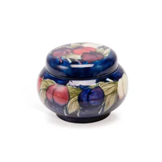A MOORCROFT 'WISTERIA PLUM' JAR AND A VASE