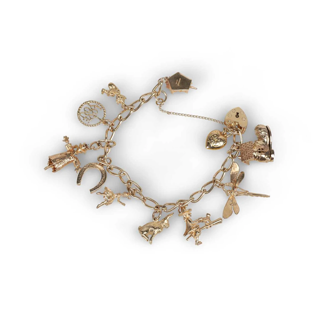 A 9 CARAT GOLD CHARM BRACELET