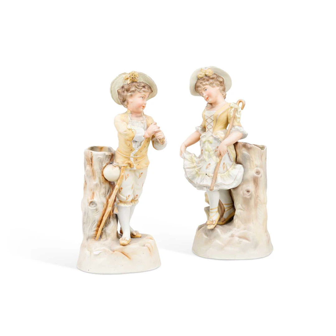 A PAIR OF GERMAN BISQUE PORCELAIN FIGURAL SPILL VASES
