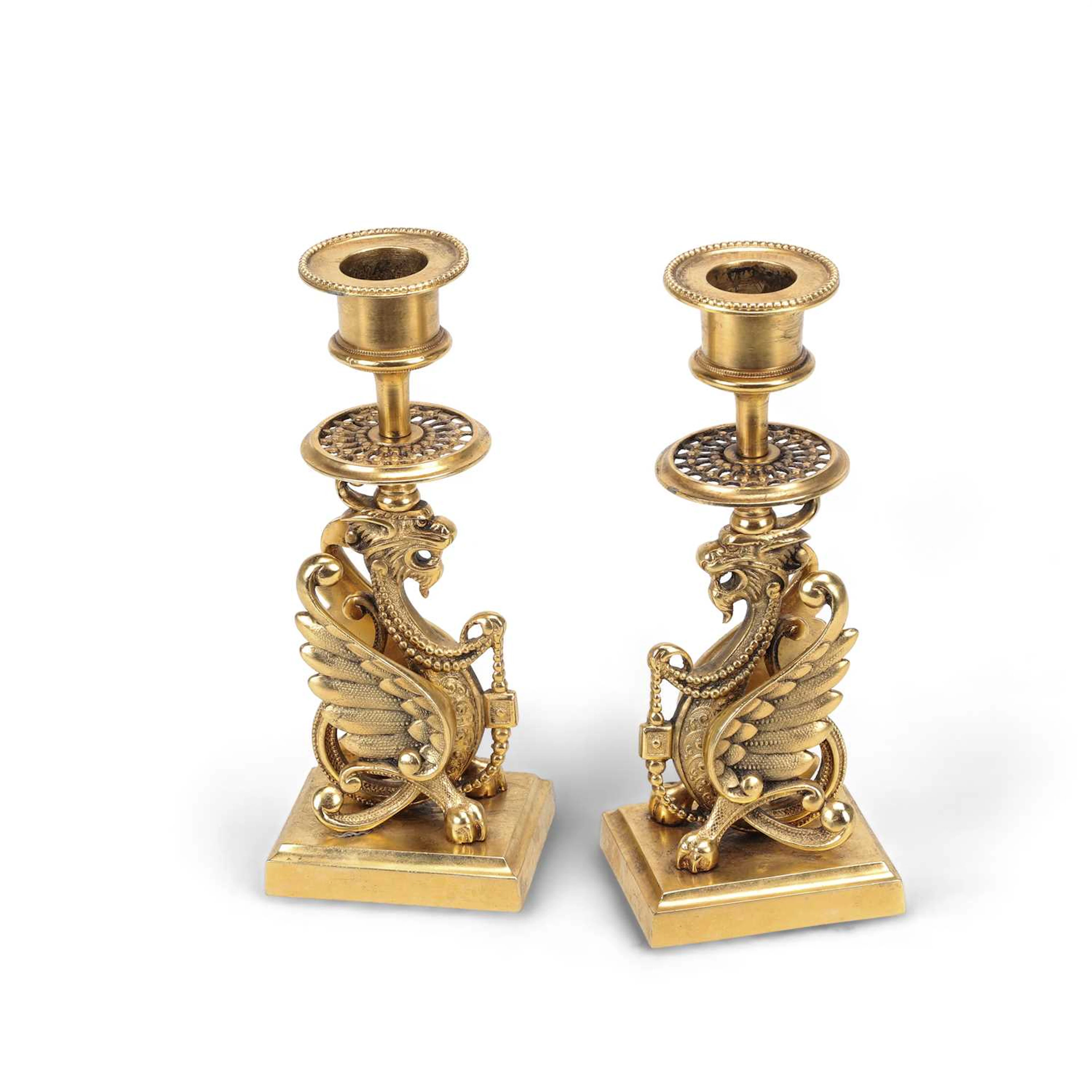 A PAIR OF GILT-METAL CANDLESTICKS