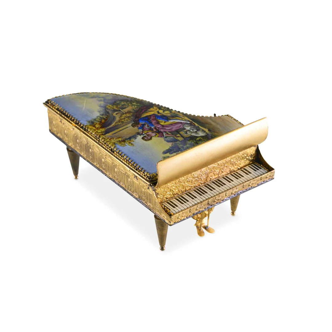 A CONTINENTAL GILT-METAL AND ENAMEL NOVELTY GRAND PIANO CASKET EARLY