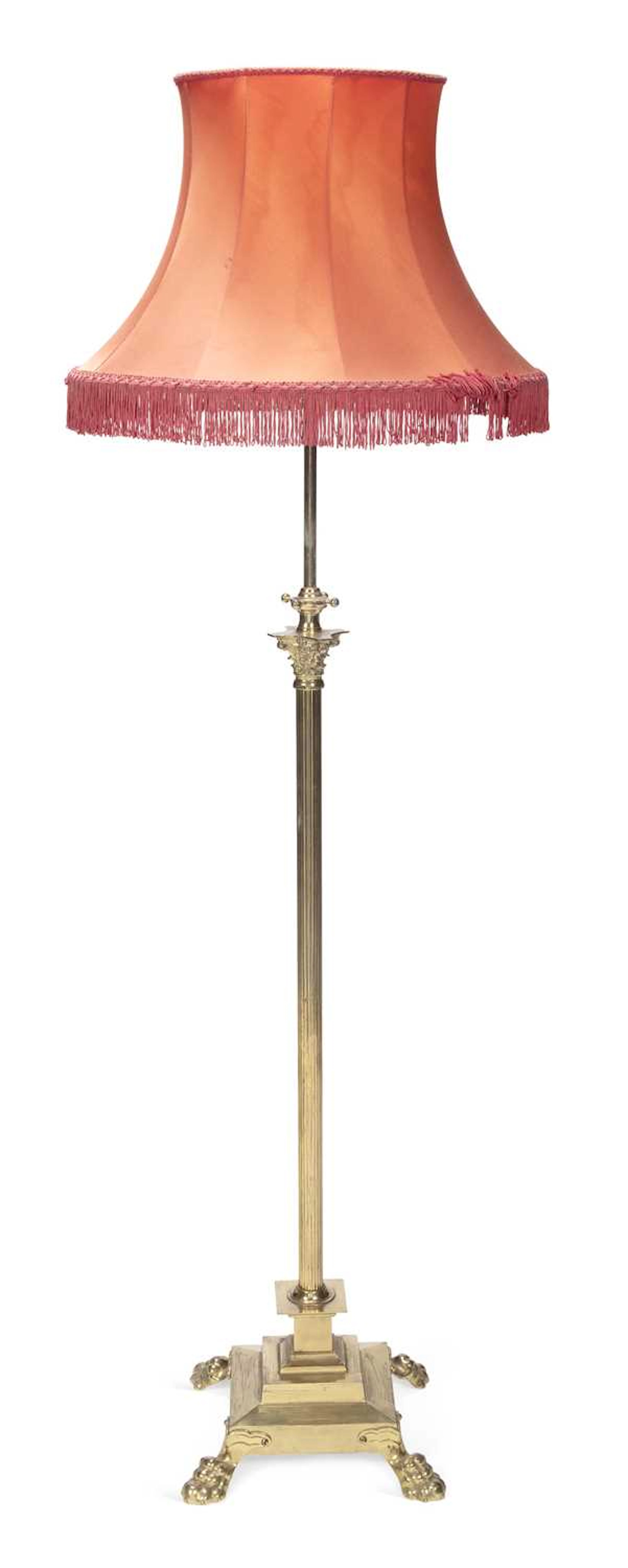 AN EARLY 20TH CENTURY BRASS STANDARD LAMP